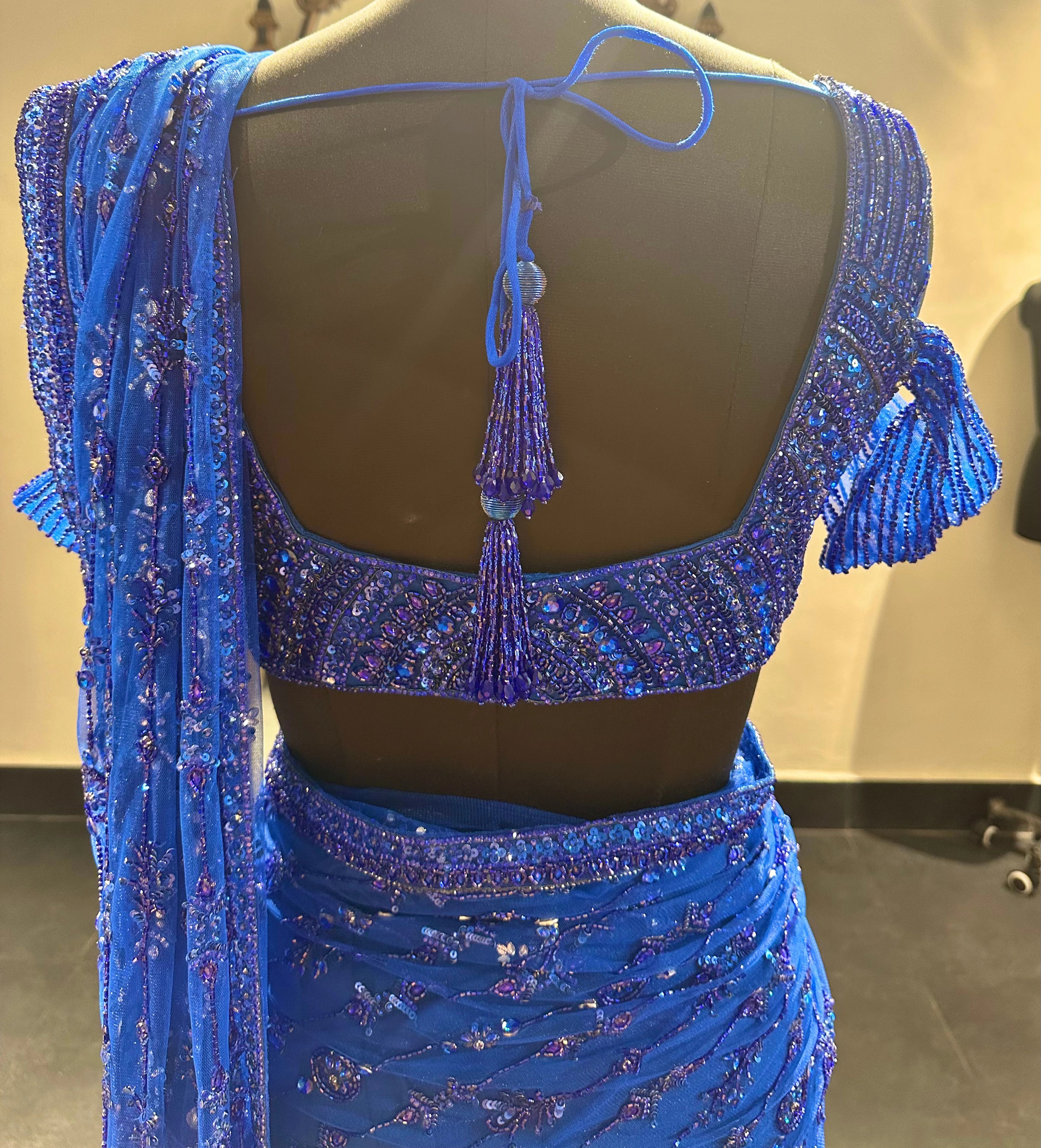 Bridesmaid Gouthami's blue tulle saree set in the studio, handcrafted by team Archana Karthick.