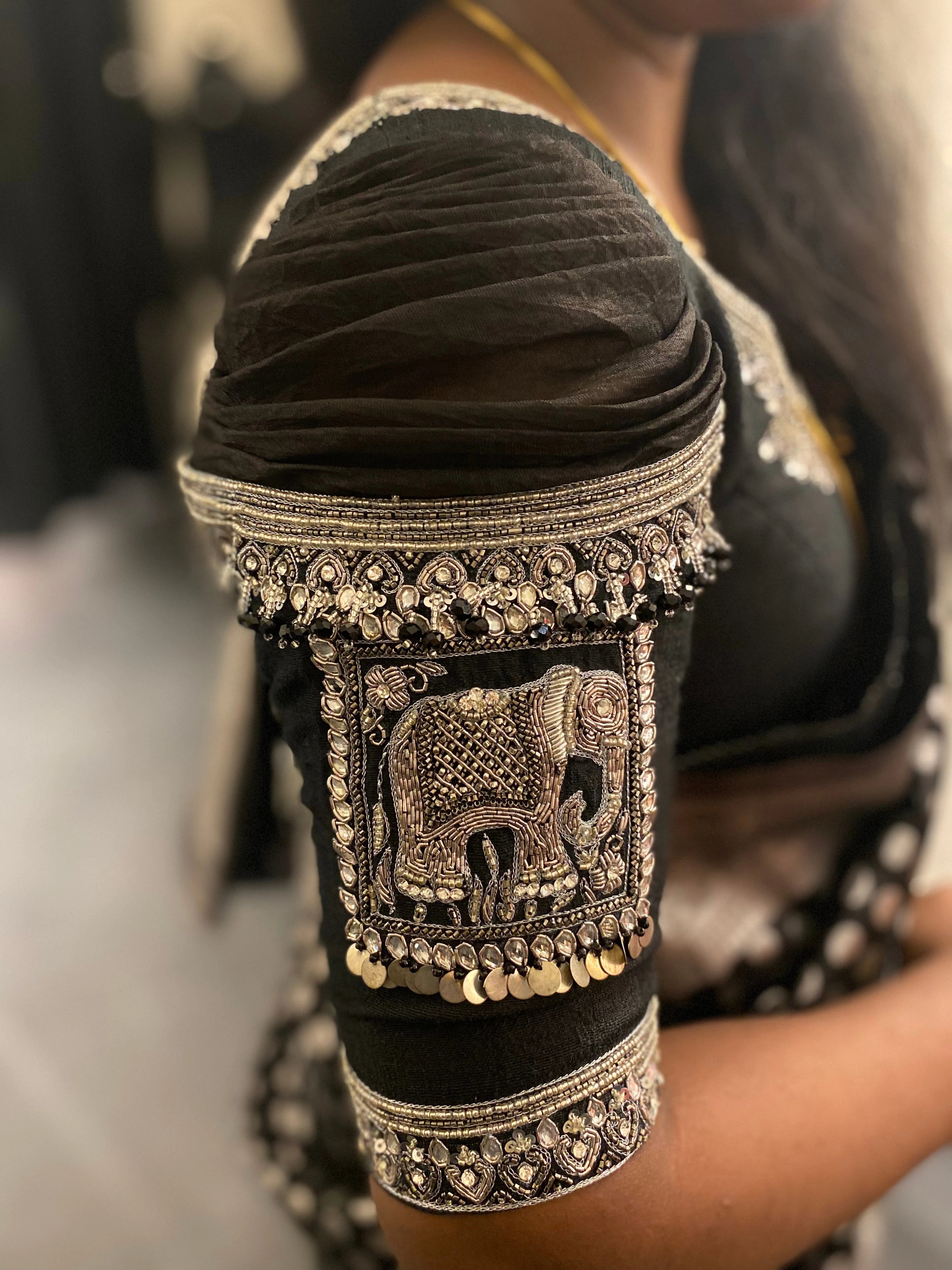 Bridesmaid Nagalakshmi during her fittings in a black rawsilk blouse, handcrafted by team Archana Karthick.