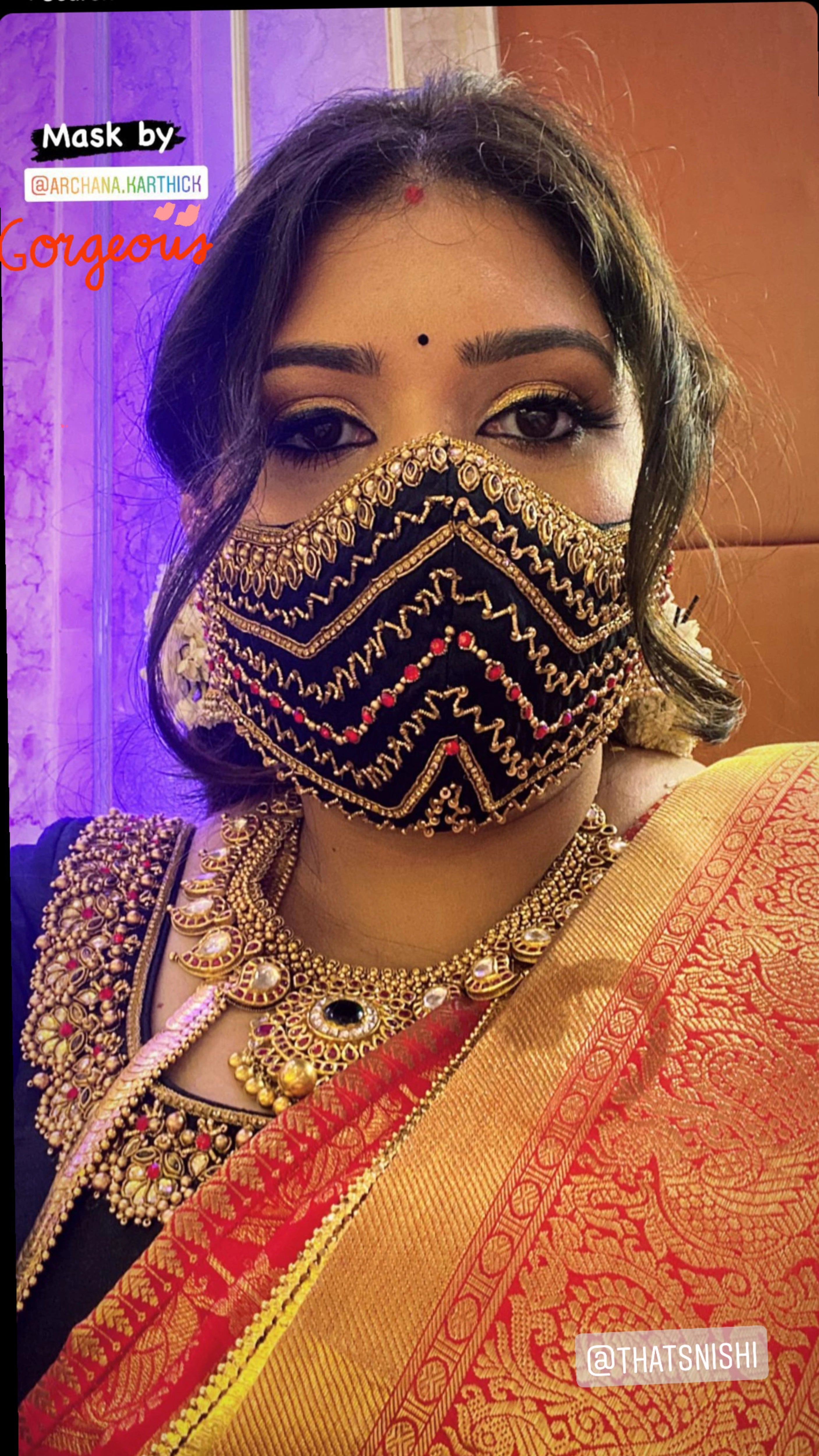 Bridesmaid Nishitha posting on insta in a black and burnt orange half saree, handcrafted with kemp stones, sequins, beads, zardozi and kundan by team Archana Karthick.