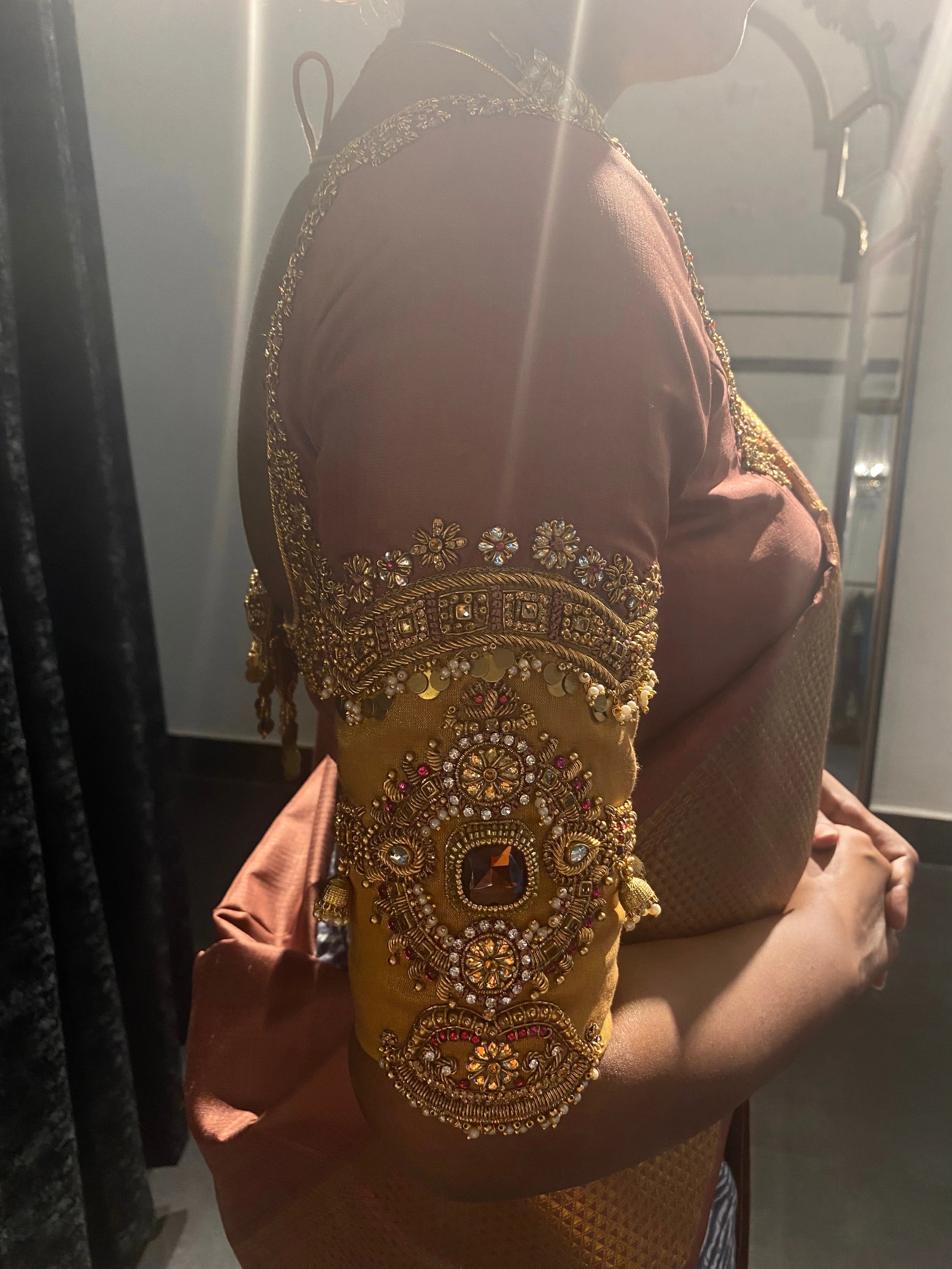 Bridesmaid Sasi during fittings in a lilac silk blouse, handcrafted by team Archana Karthick.