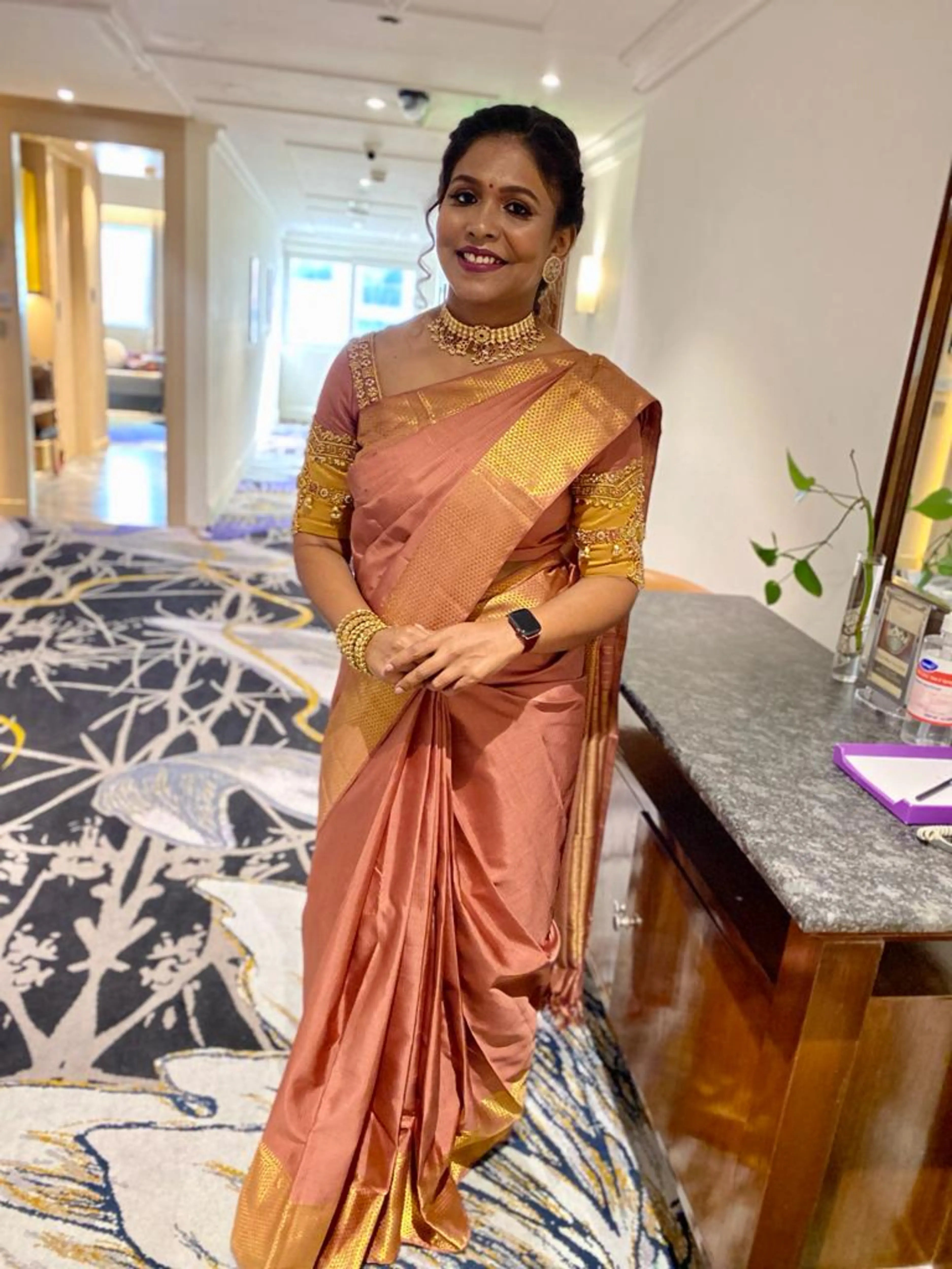 Bridesmaid Sasi in a lilac silk blouse, handcrafted by team Archana Karthick.