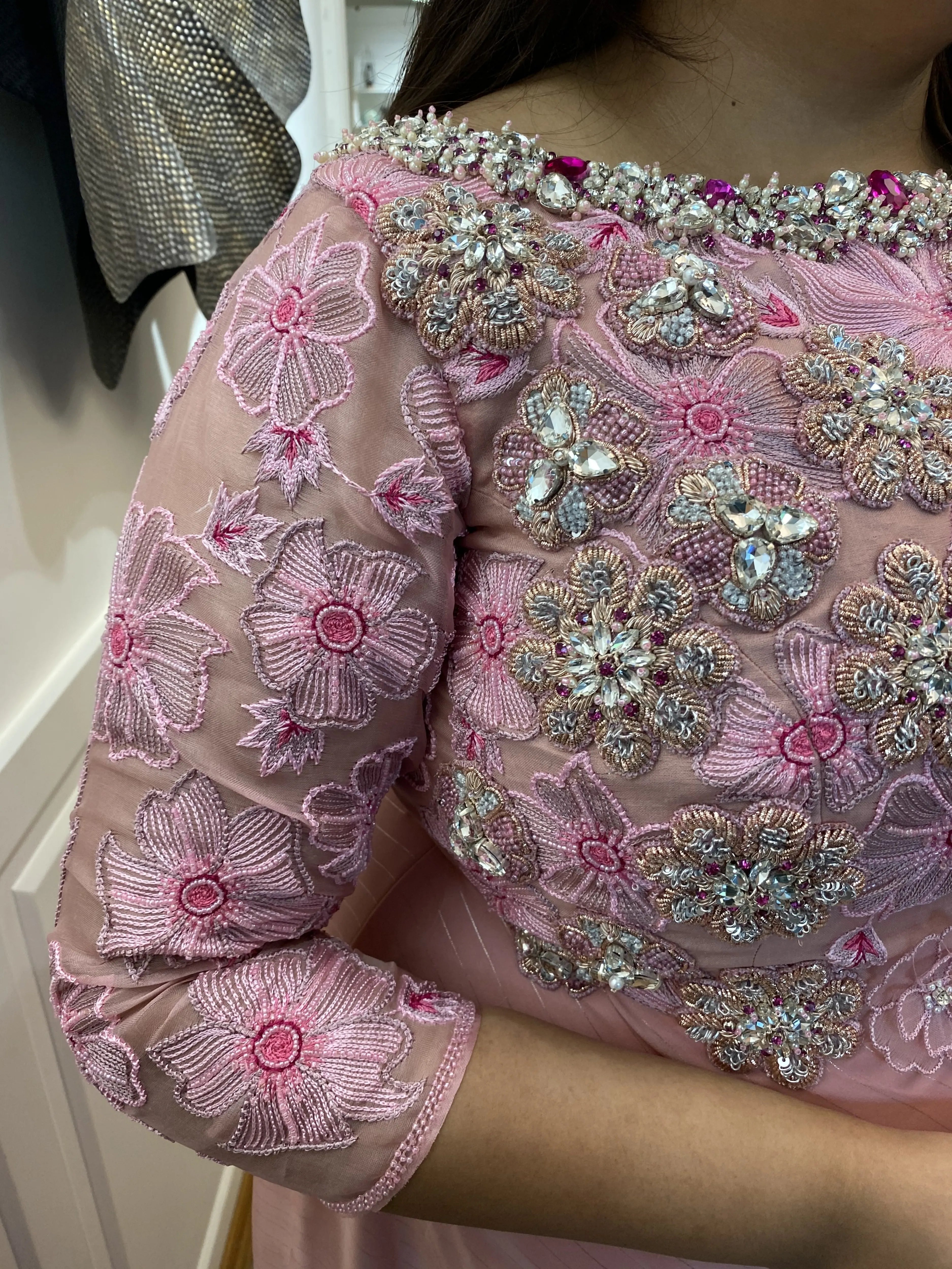 Bridesmaid from Chennai for her fittings in a pink organza gown handcrafted intricately with zardozi, stones, pearls and 3D floral appliques designed by Archana Karthick.