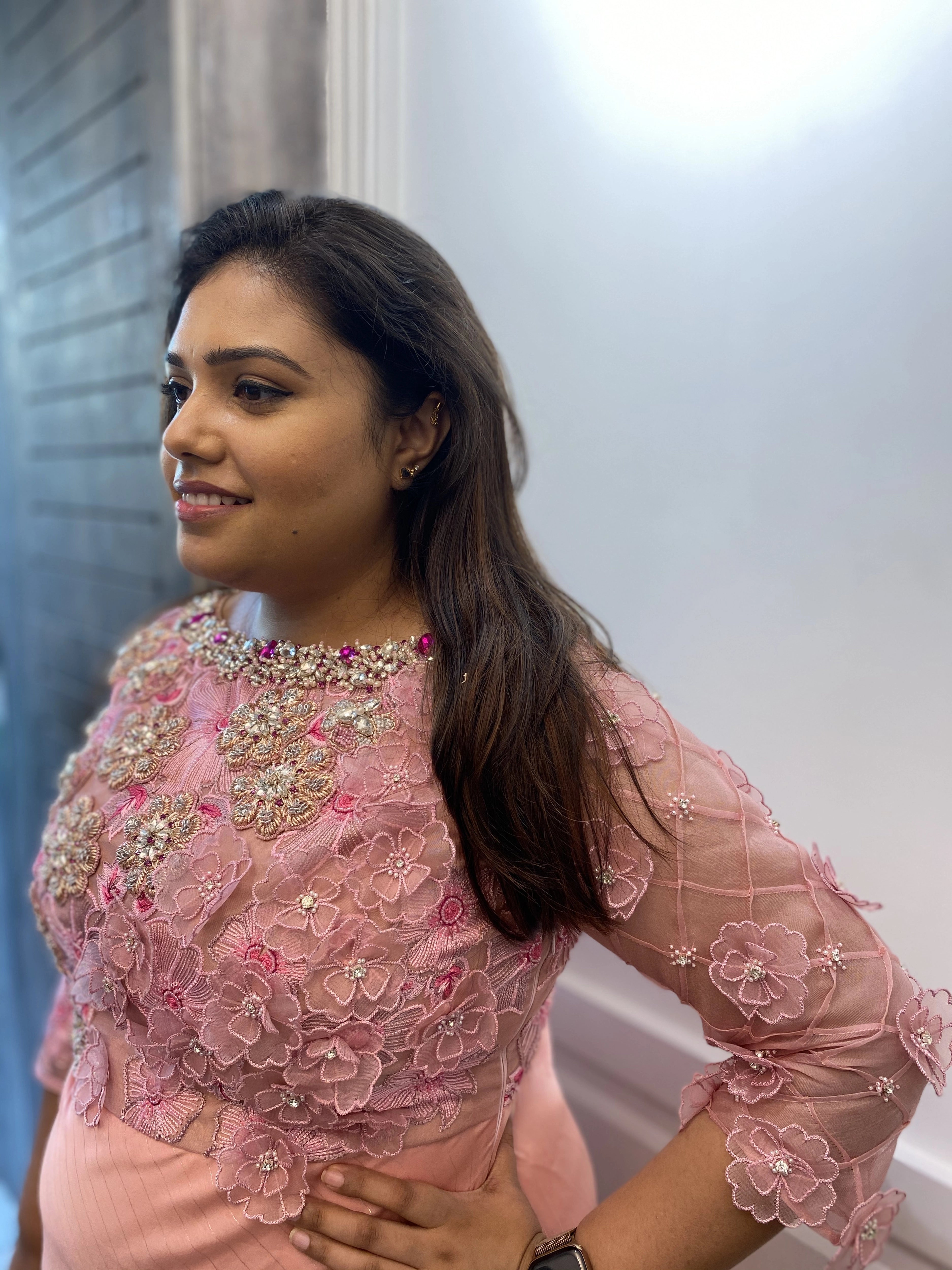 Bridesmaid from Chennai in a pink organza gown handcrafted intricately with zardozi, stones, pearls and 3D floral appliques designed by Archana Karthick.