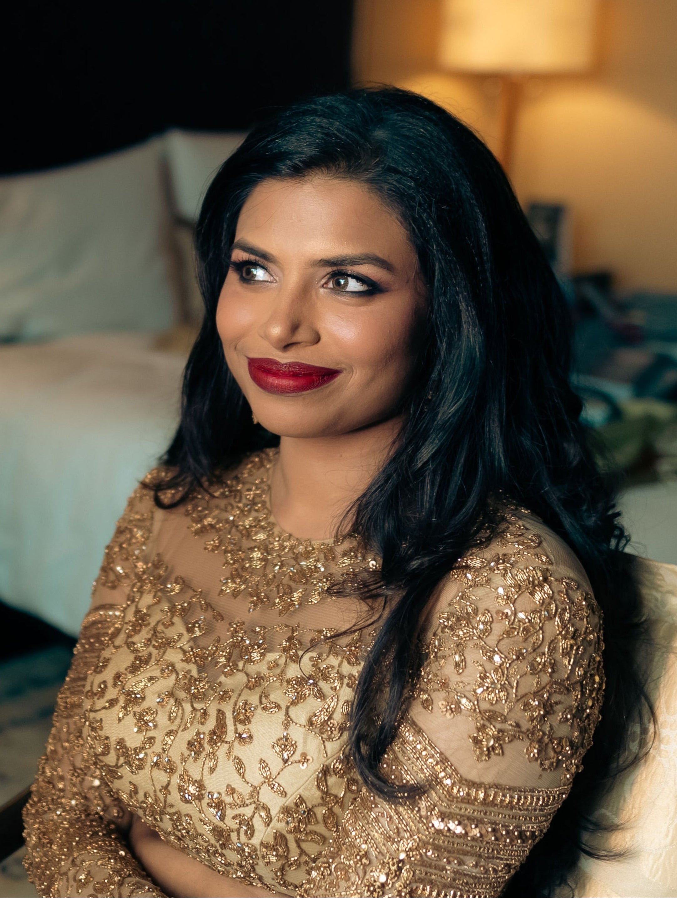 Christian Bride Steffi in handcrafted net saree in champagne gold designed by Archana Karthick. Closeup picture clearly shows the intricacy of the handcrafted blouse.