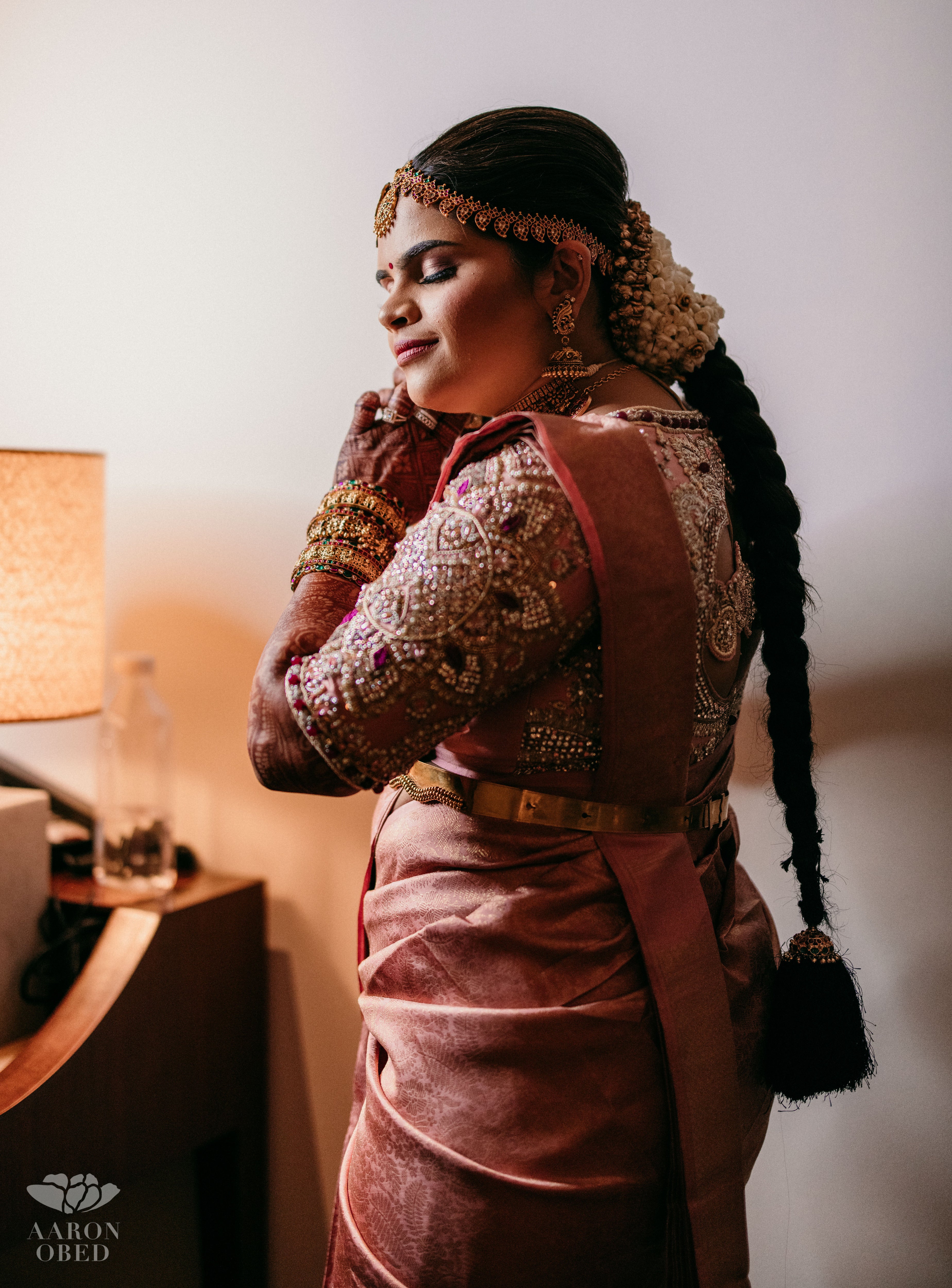 Comedian and actress Vidyu Raman styling in a palanquin concept pink blouse handcrafted intricately with resham knot work, cut dana, crystal, pearls, swarovski stones and sequins designed by Archana Karthick.