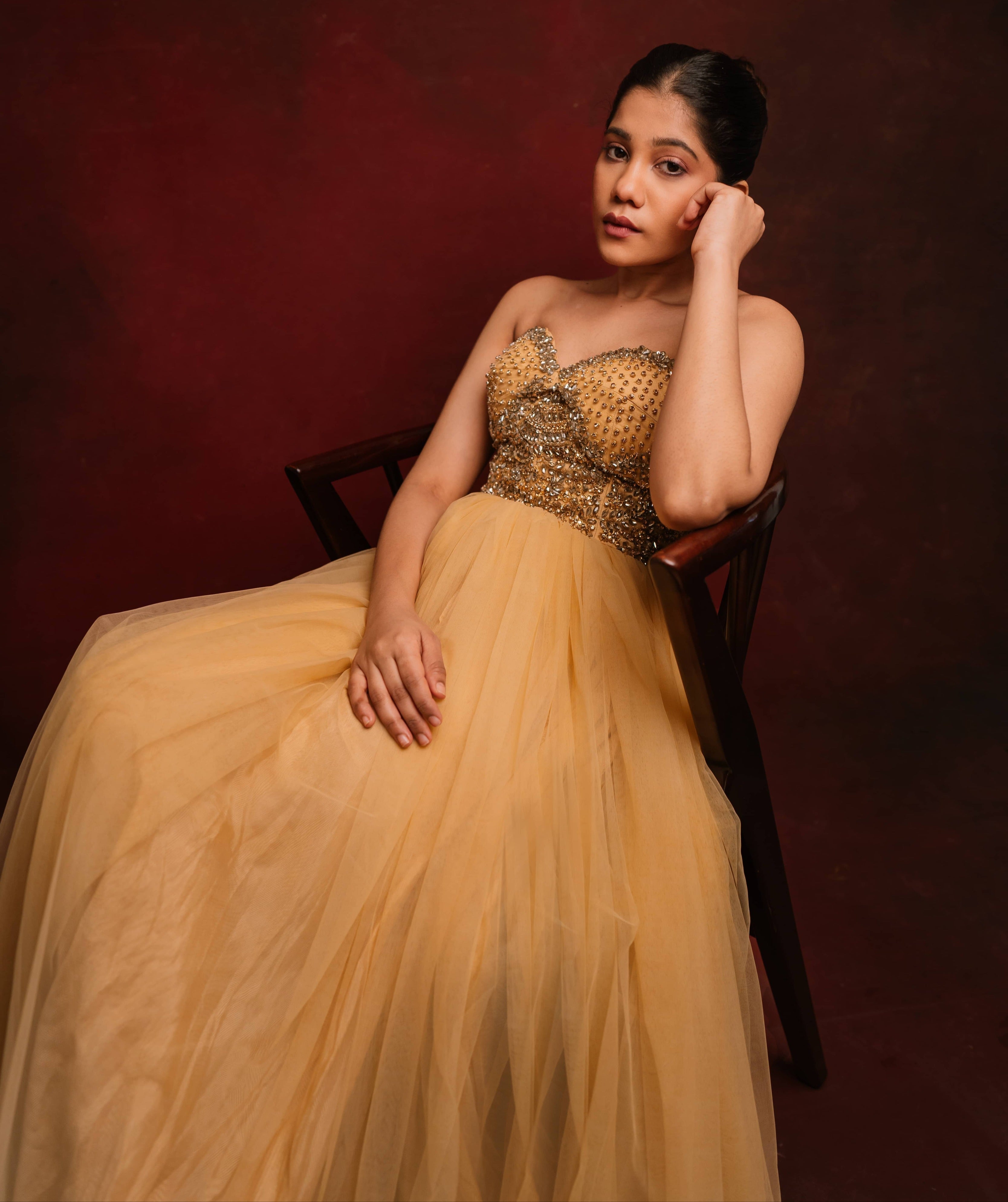 Gold corset dress intricately handcrafted with stones and sequins designed by team Archana Karthick.