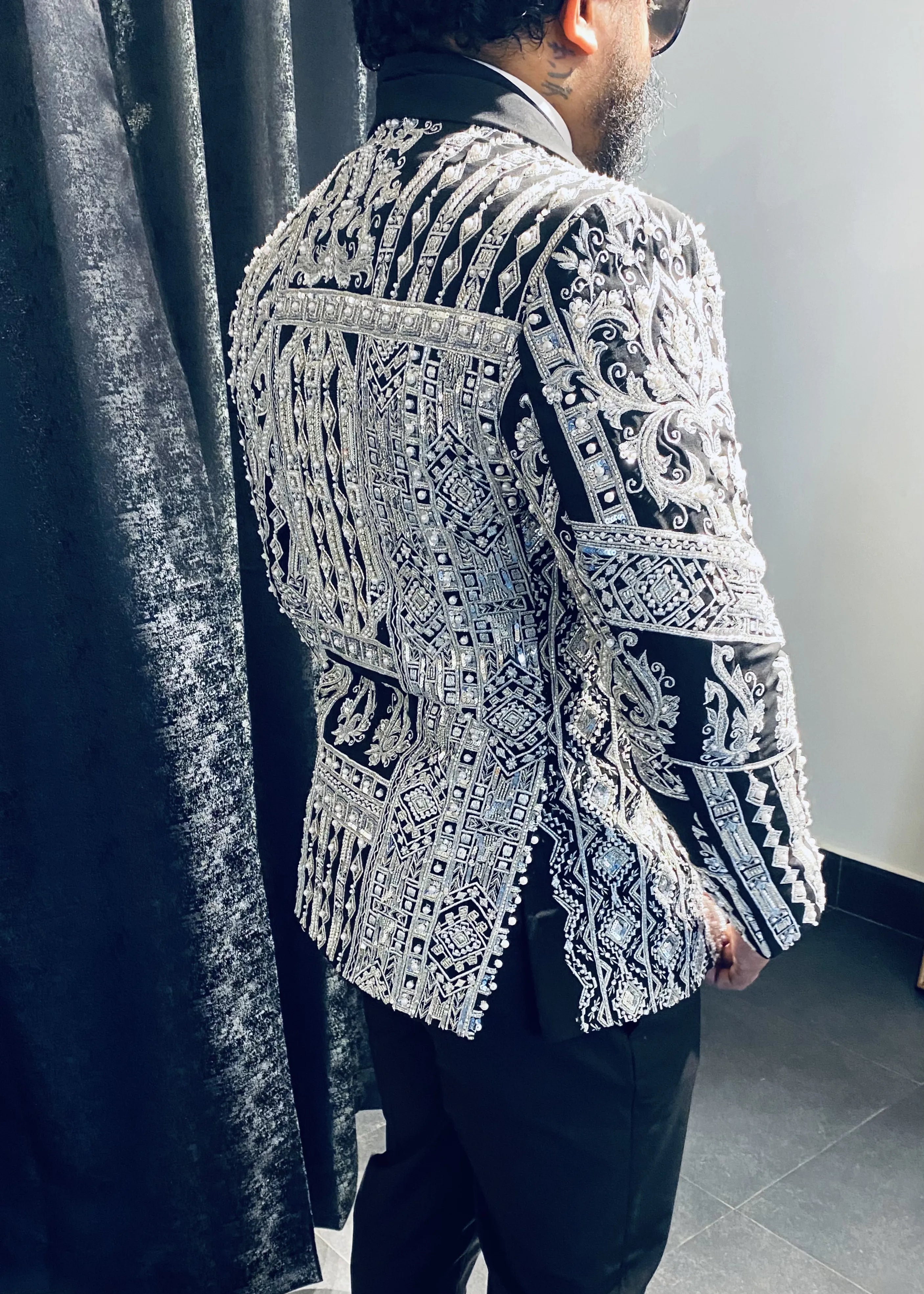 Groom (Chennai) for fitting session in a bespoke suit by Archana Karthick. Jacket embellished with zardozi, cut dana, beads, stone work and sequins.