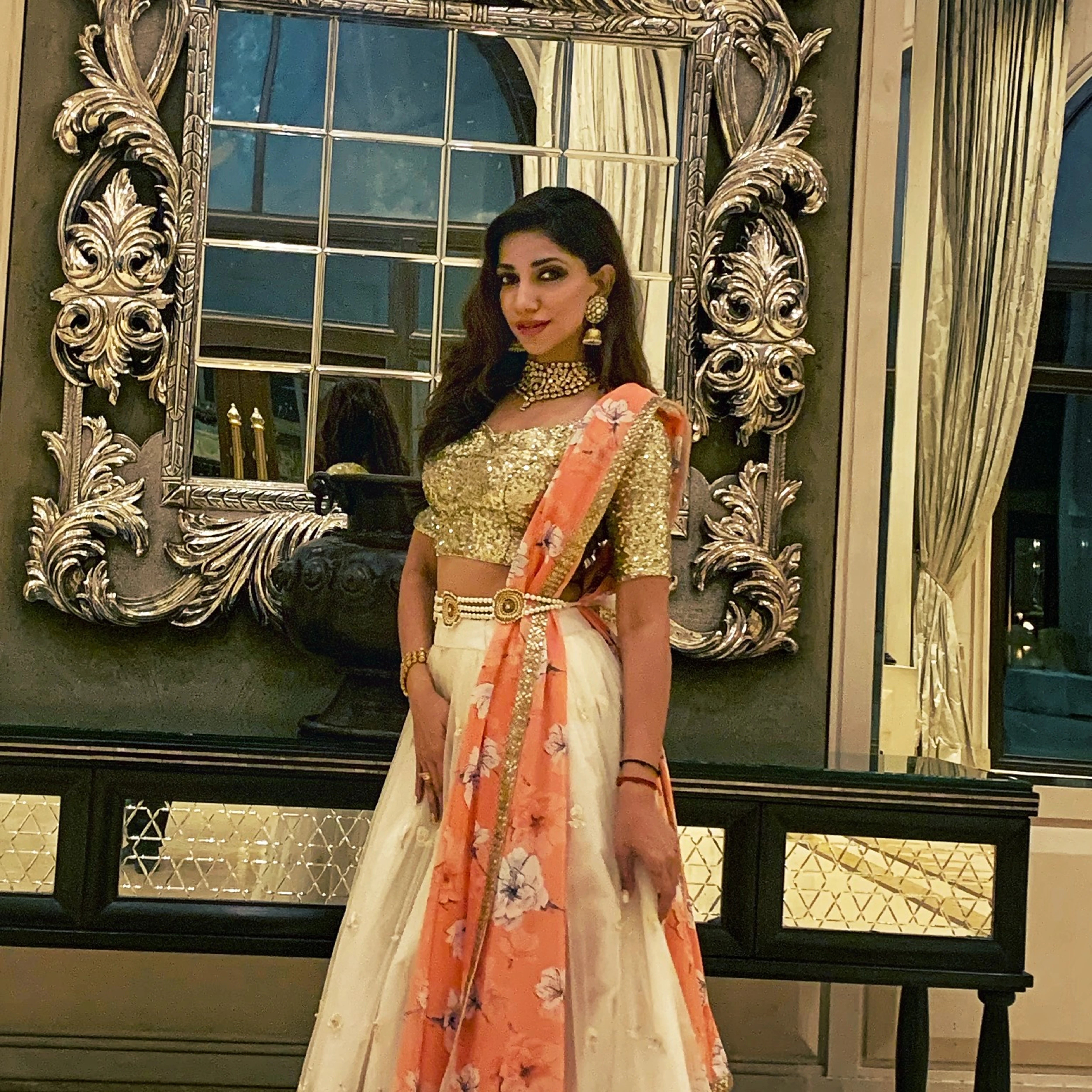 IPL commentator, anchor and playback singer Bhavana Balakrishnan smiling in a lehenga designed by Archana Karthick.