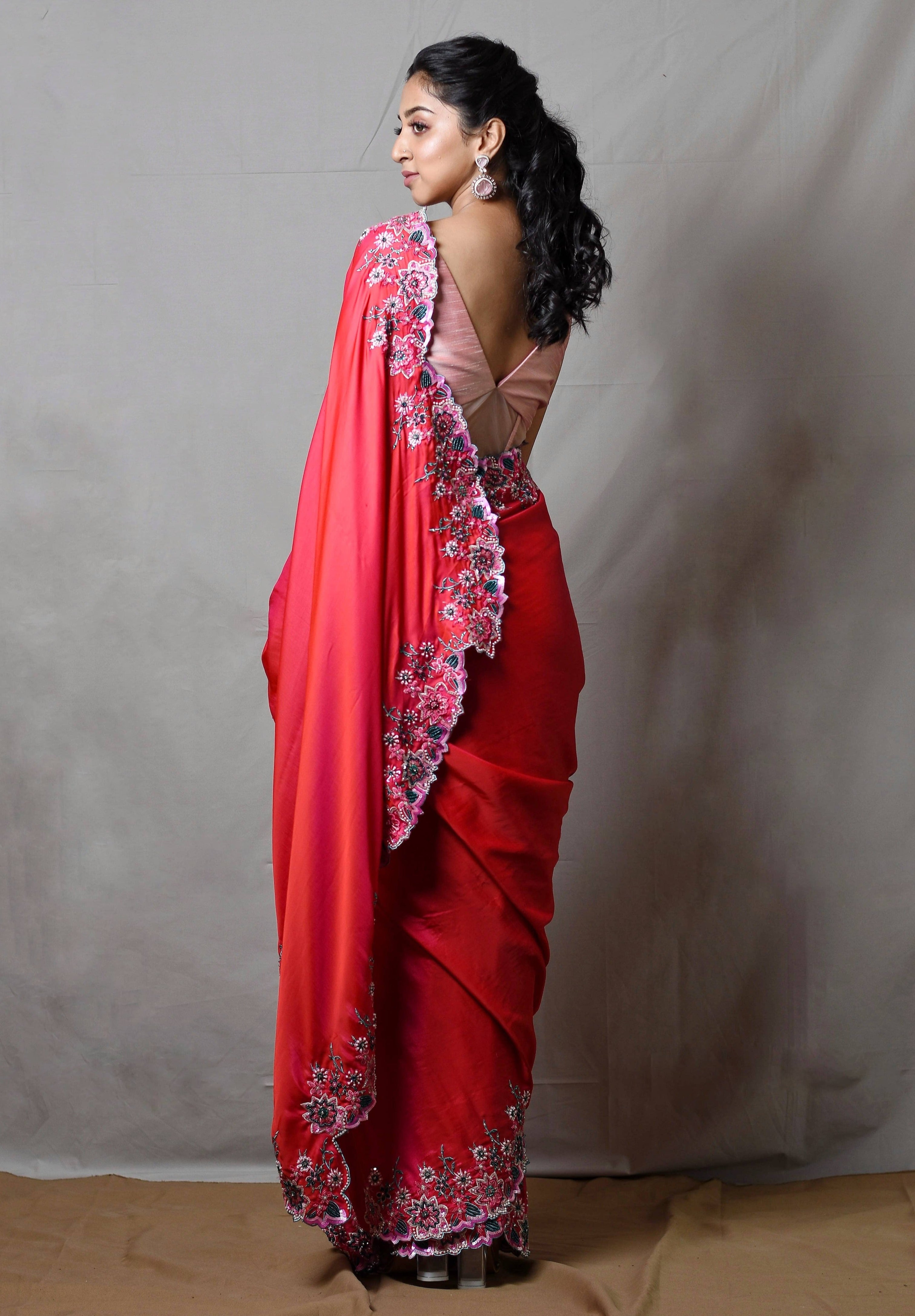 Influencer Deekshita Nikkam in a pink shimmer georgette saree paired with raw silk corset blouse designed by Archana Karthick. Blouse back and saree border design.