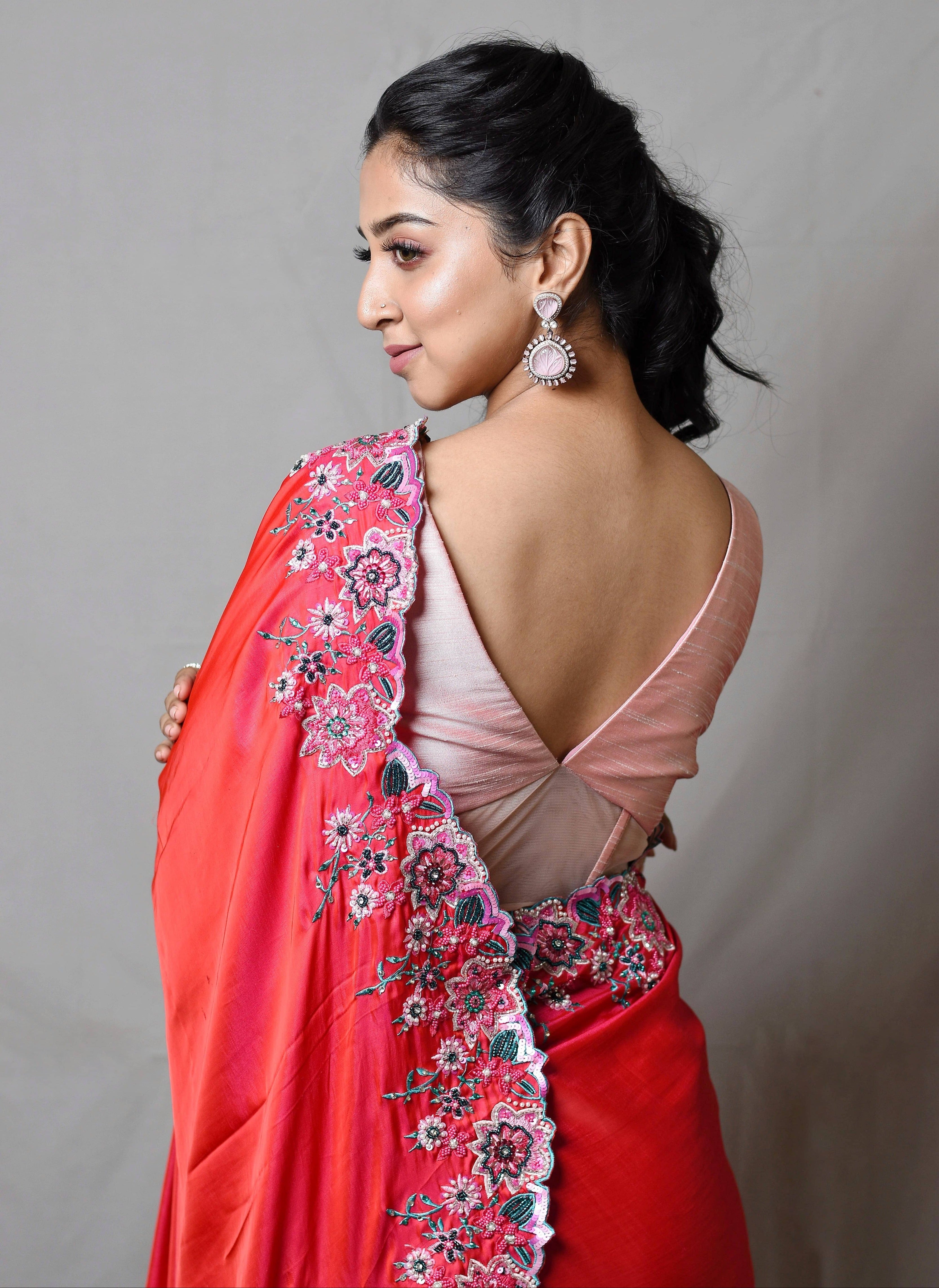 Influencer Deekshita Nikkam in a pink shimmer georgette saree paired with raw silk corset blouse designed by Archana Karthick. Blouse back design and saree border detailing
