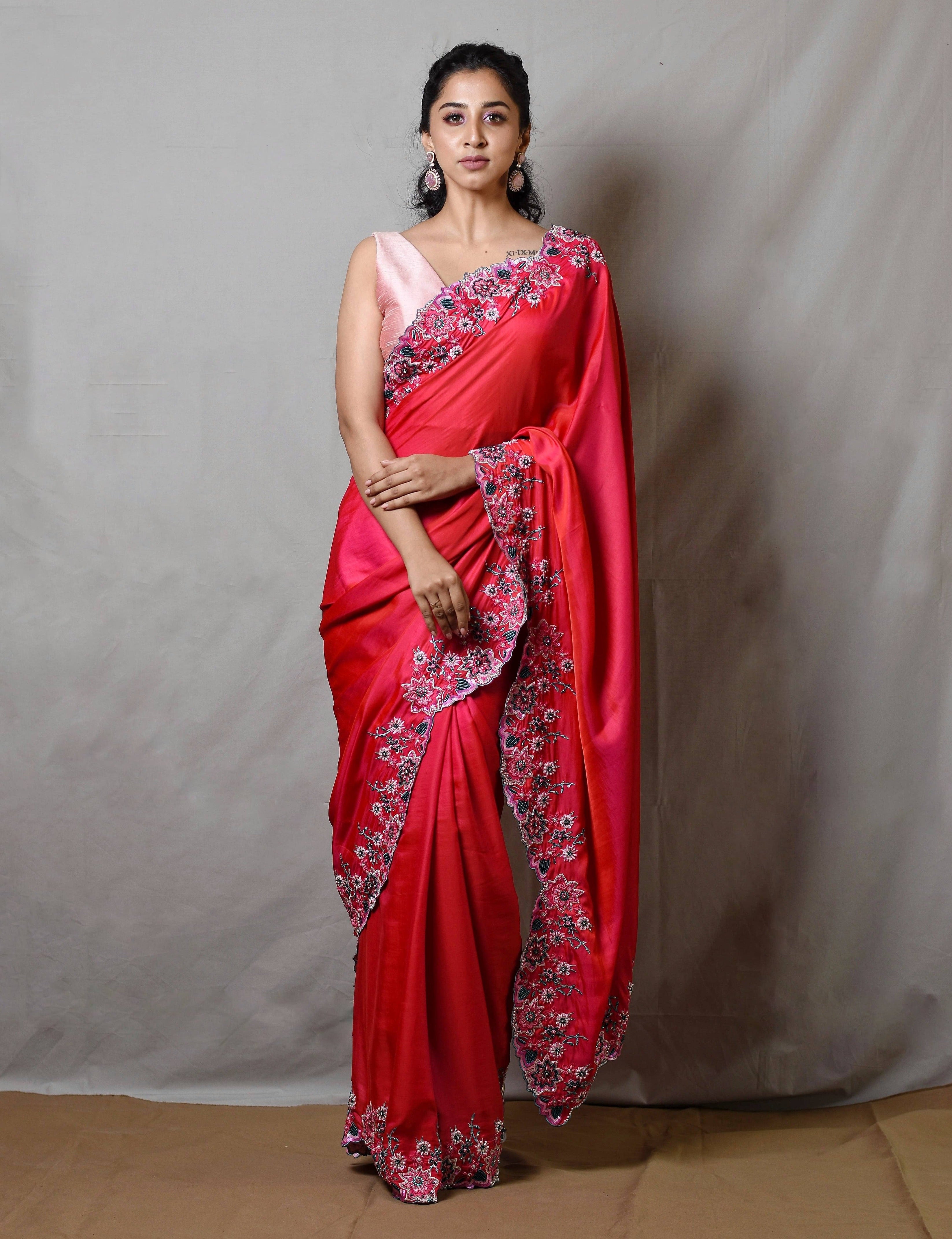 Influencer Deekshita Nikkam in a pink shimmer georgette saree paired with raw silk corset blouse designed by Archana Karthick. Full front profile.