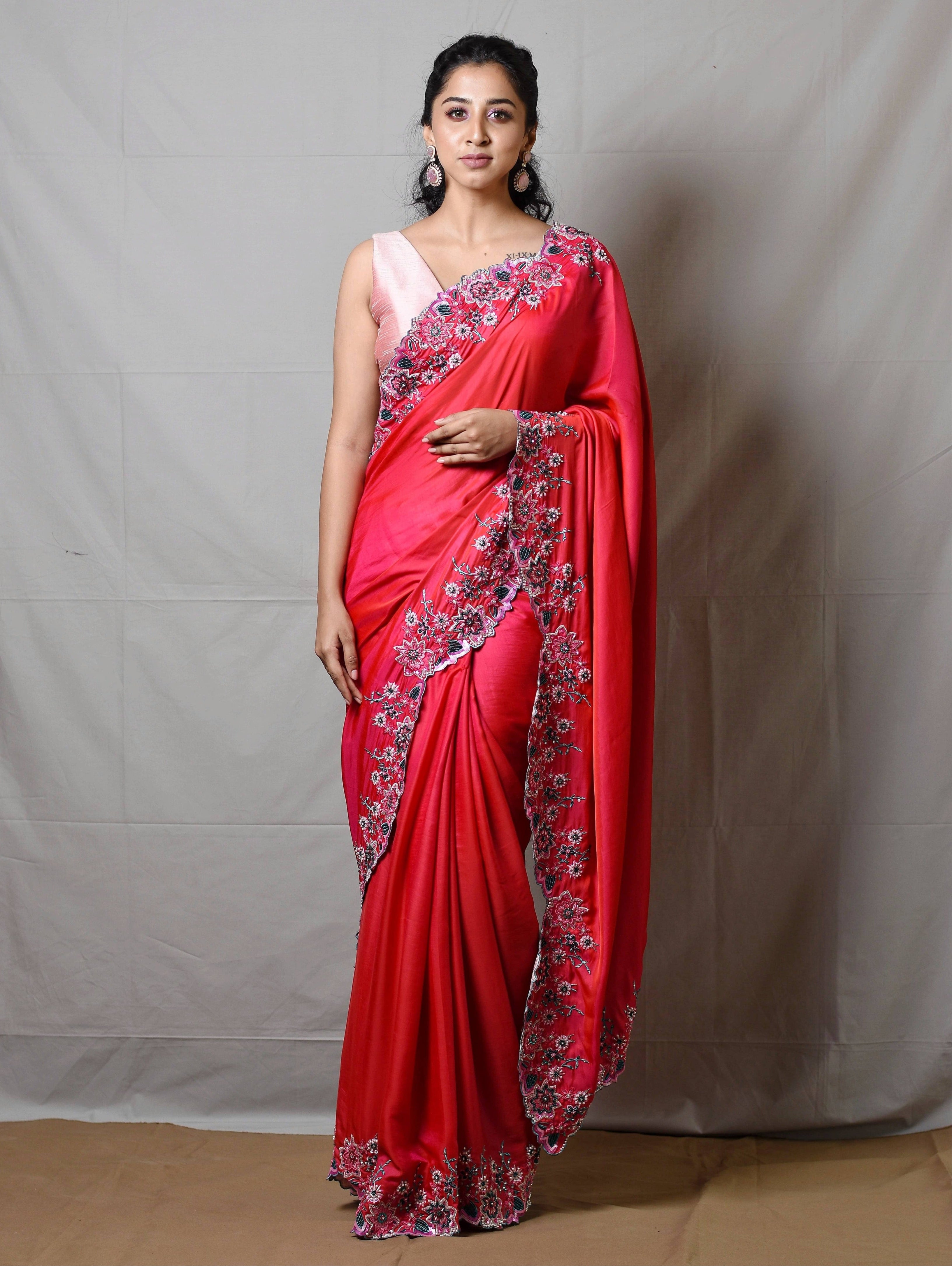 Influencer Deekshita Nikkam in a pink shimmer georgette saree paired with raw silk corset blouse designed by Archana Karthick. Full front profile pose.