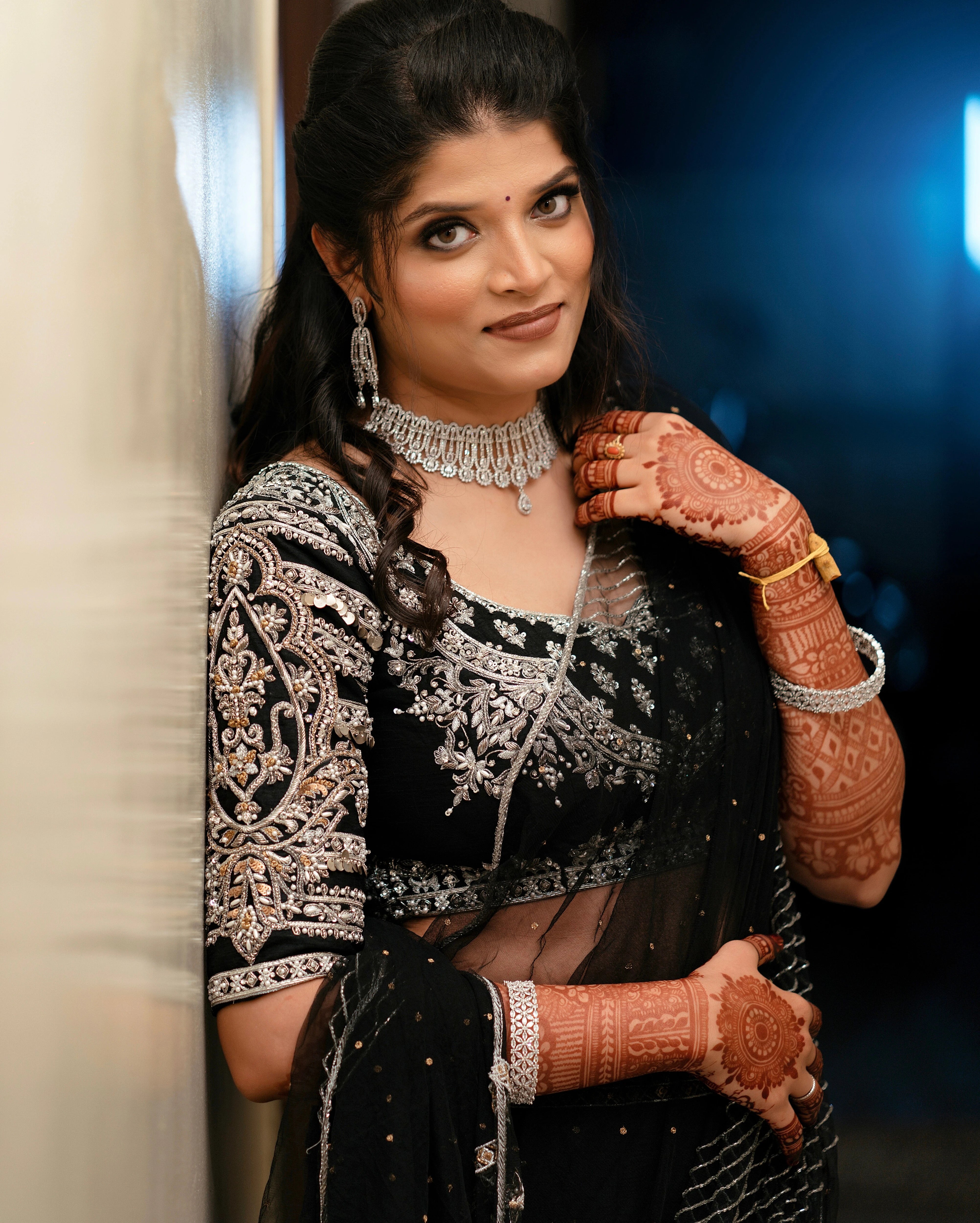 Kamakshi from Yokosuka, Japan, in a black raw silk lehenga handcrafted by team Archana Karthick.