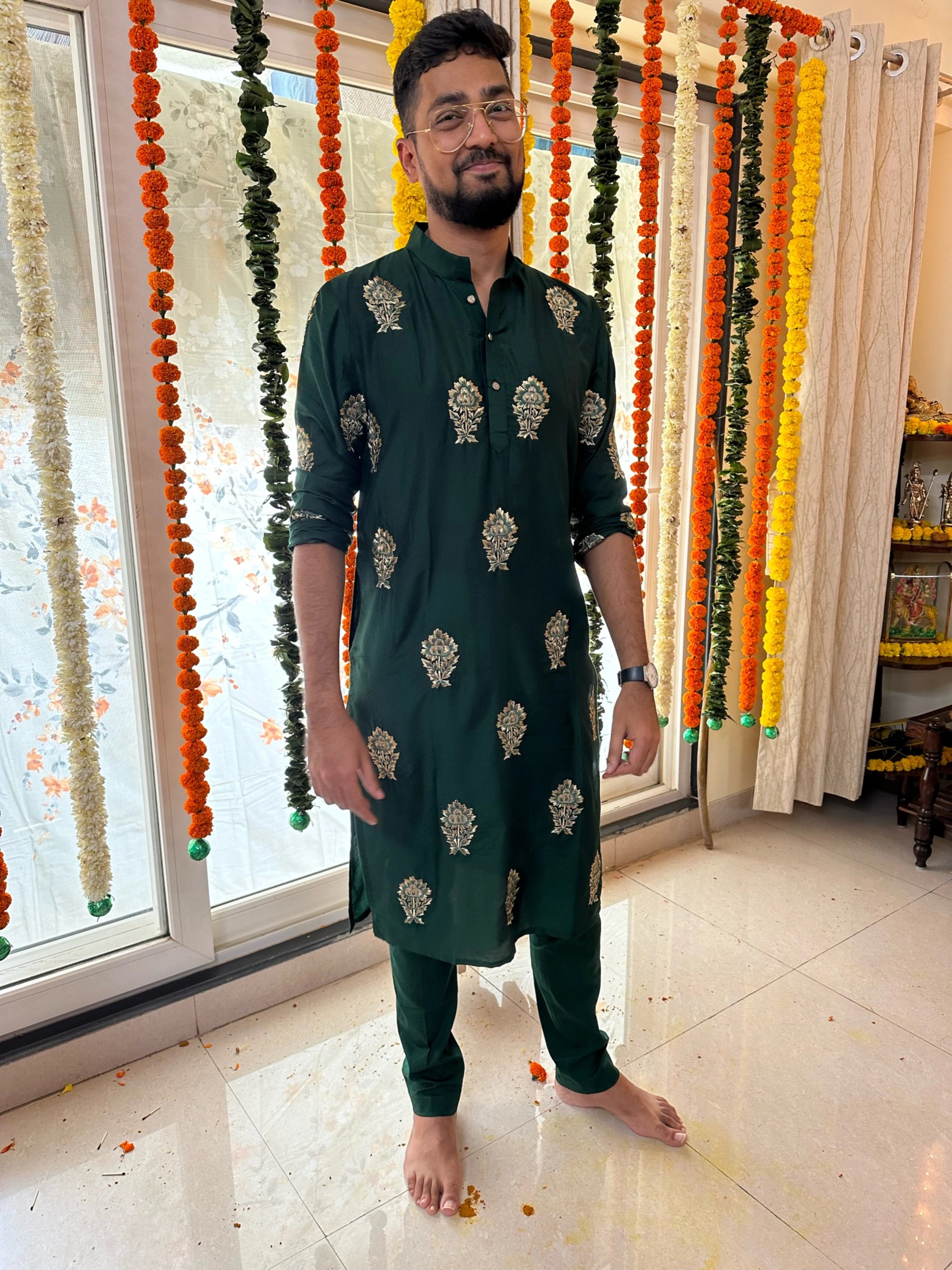 Mahesh from Bangalore in a bottle green kurta handcrafted by team Archana Karthick.
