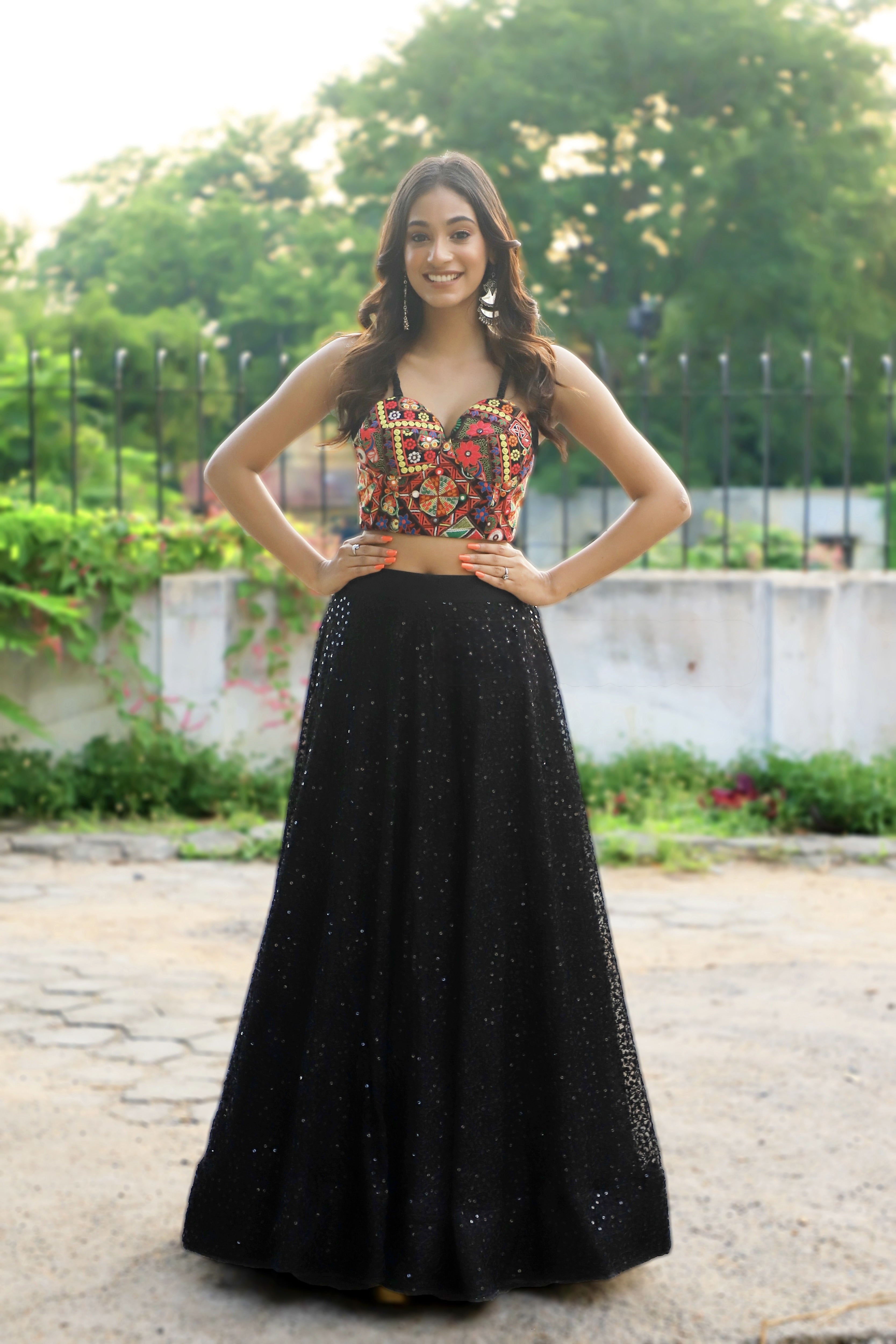 Miss India 2018 and actress Anukreethy Vas in a partywear corset and skirt. Full profile front pose.