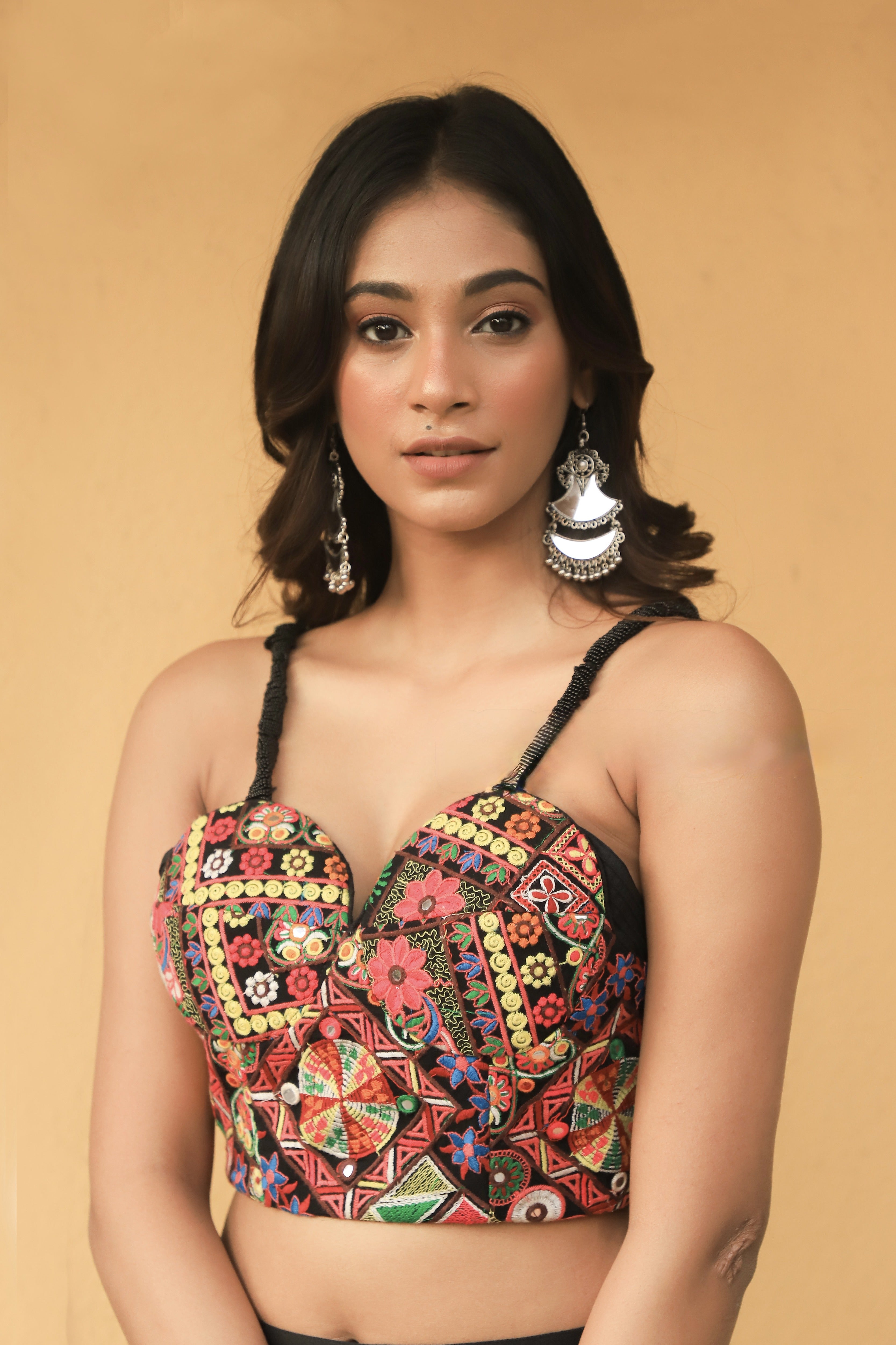 Miss India 2018 and actress Anukreethy Vas in a partywear corset and skirt. looking at lens front profile blouse full.