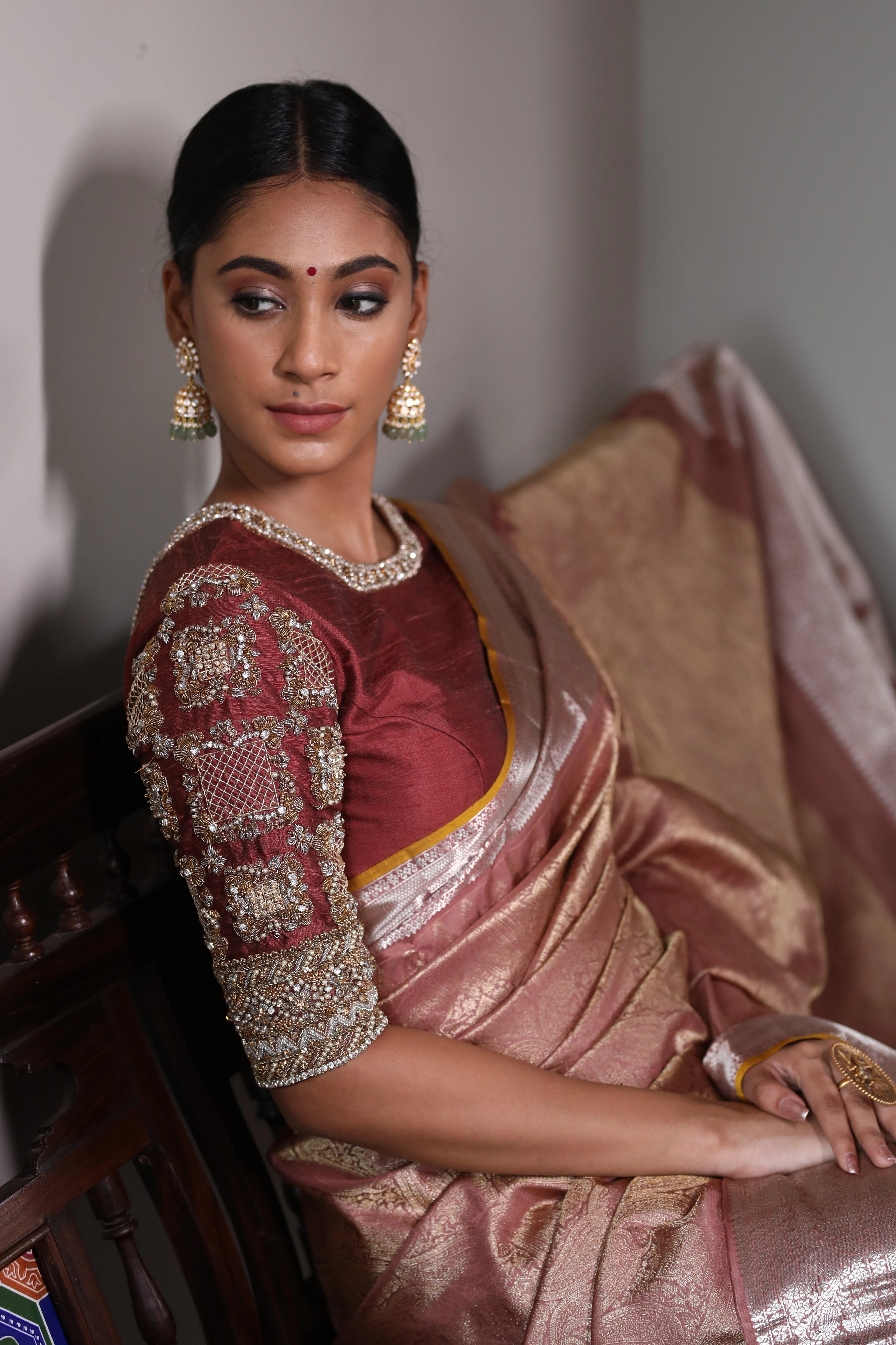Miss India and Actress Anukreethy Vas in a rose gold raw silk blouse, intricately handcrafted with pearls, zardozi, stones and zari by team Archana Karthick.