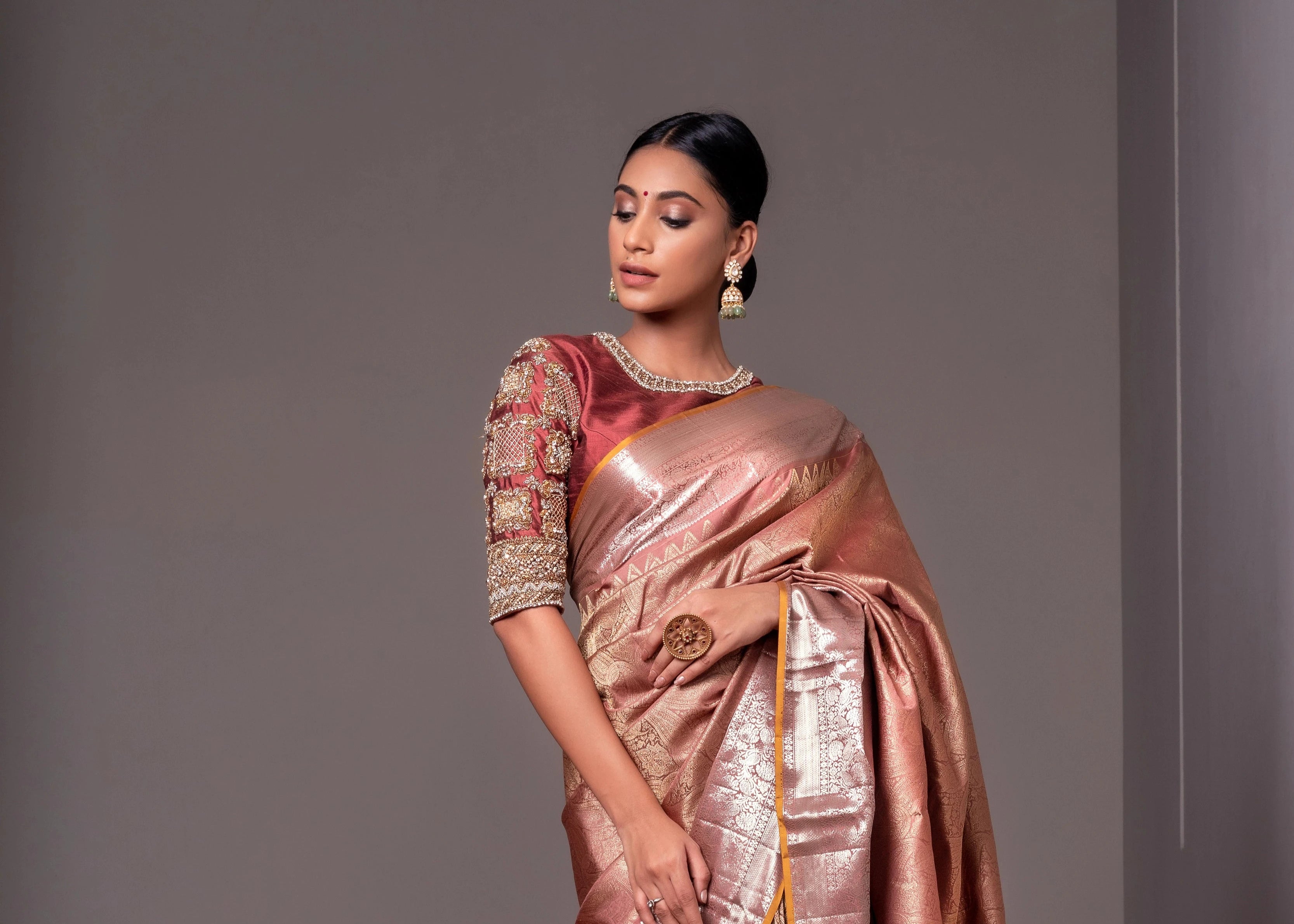 Miss India and Actress Anukreethy Vas looking stylish in a rose gold raw silk blouse, intricately handcrafted with pearls, zardozi, stones and zari by team Archana Karthick.