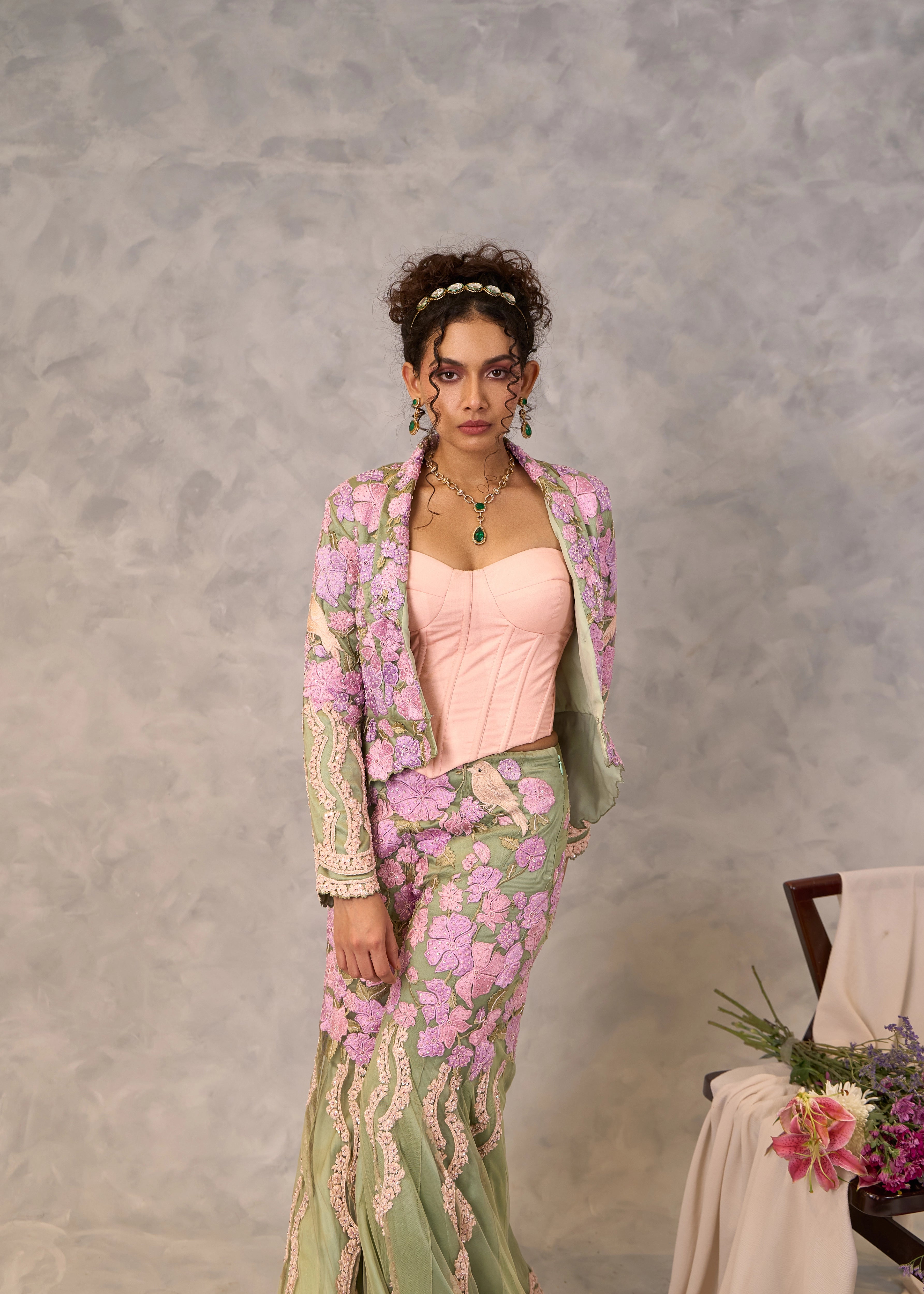 Model Keryn Justina Roy in a sage green sharara and jacket with pink corset. Perfect party look.