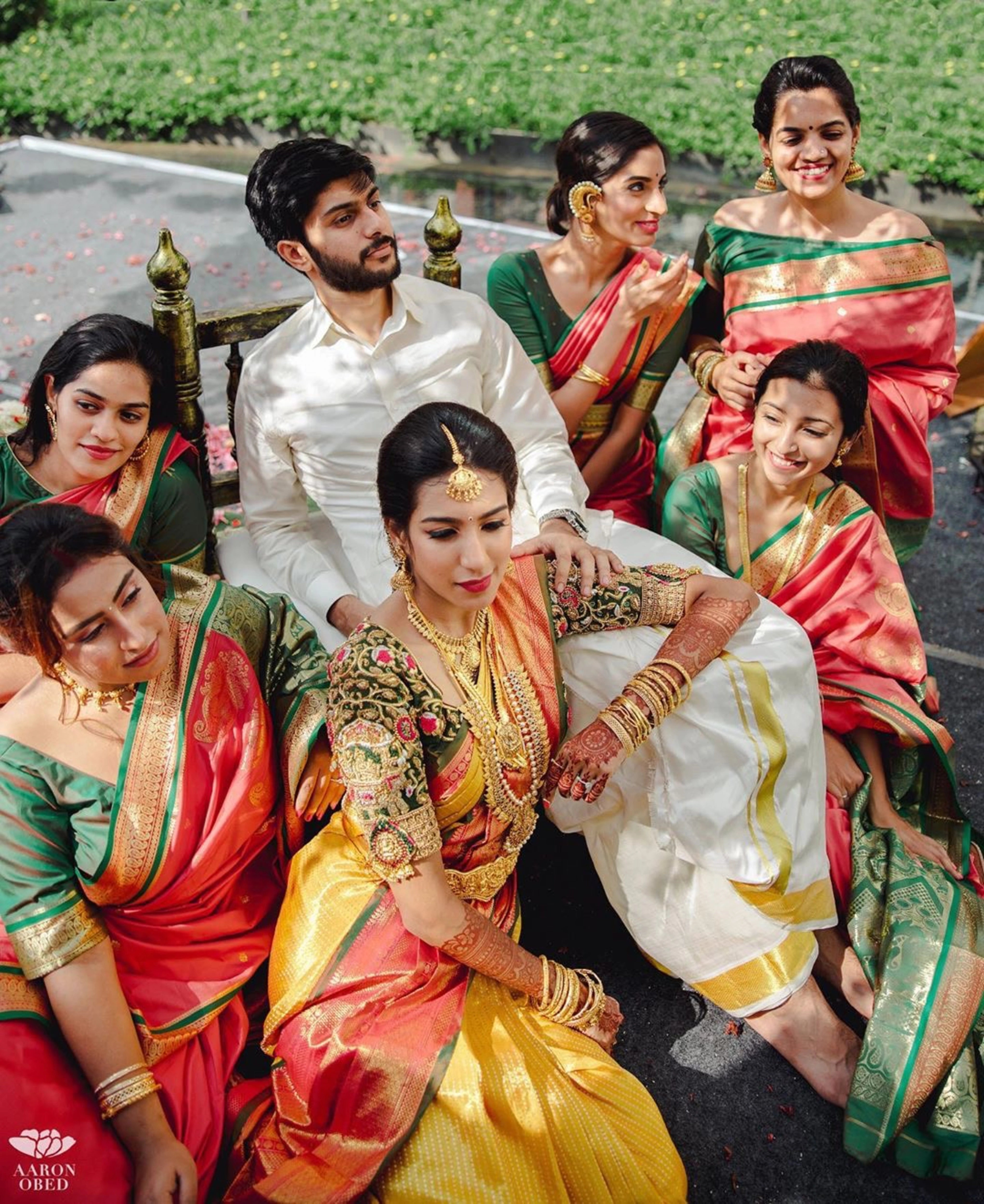 Model Ashwini Kumar in a green silk blouse for her wedding photoshoot with Kavin Venkatesh of Maybell, handcrafted intricately with stones, pearls, zardozi, beads, zari and knot work by team Archana Karthick.