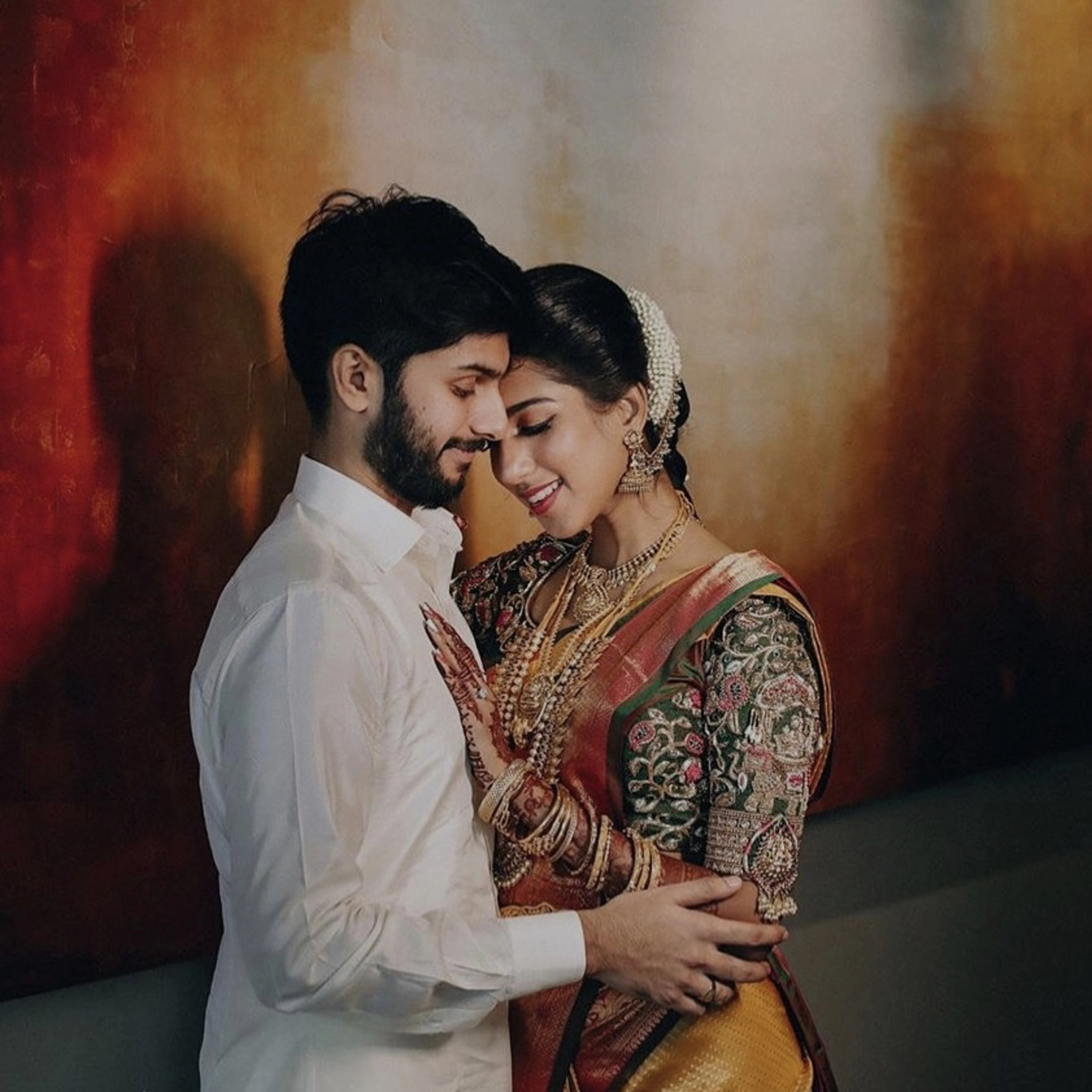 Model Ashwini Kumar in a green silk blouse for her wedding with Kavin Venkatesh of Maybell, handcrafted intricately with stones, pearls, zardozi, beads, zari and knot work by team Archana Karthick.