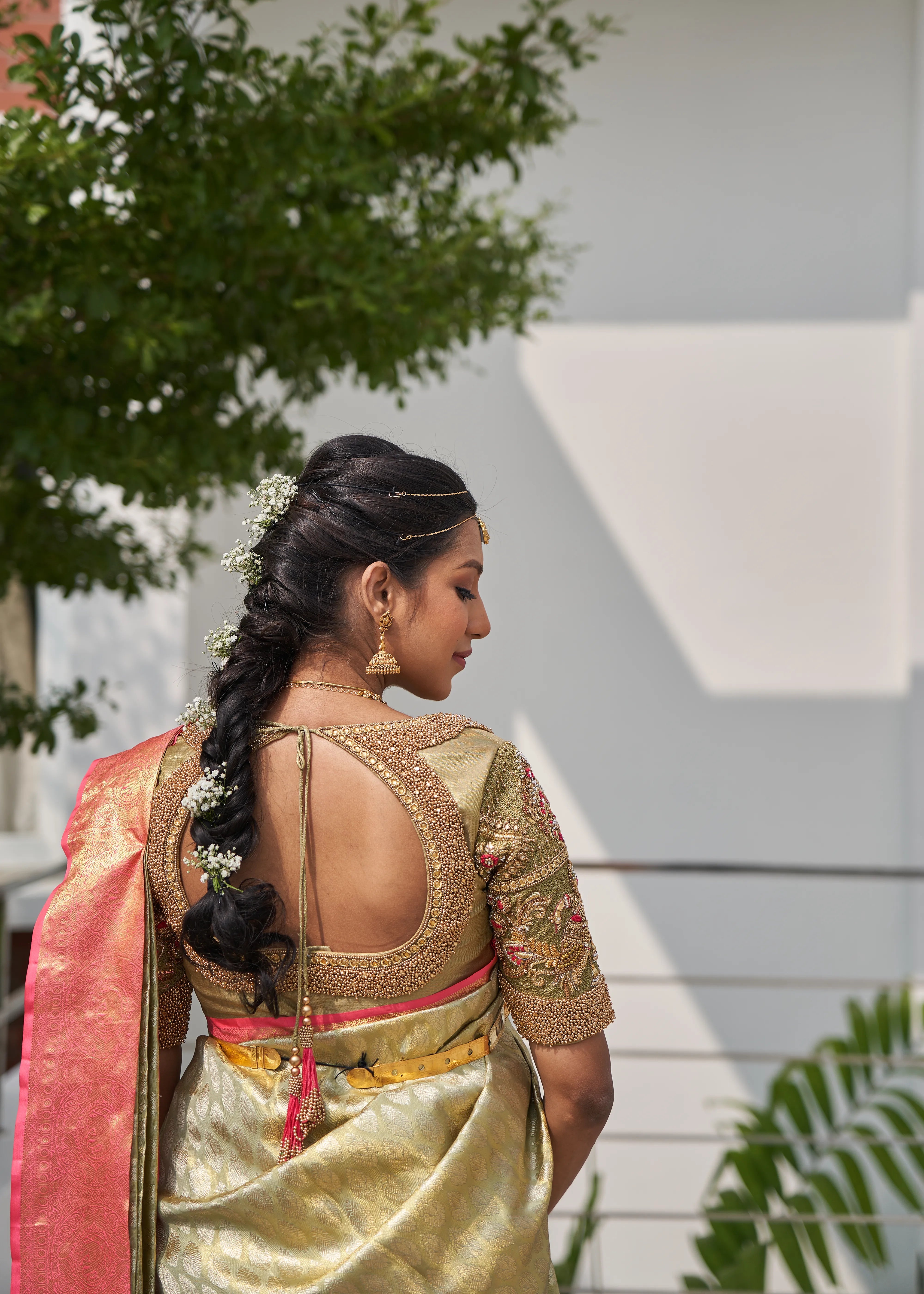 Model Ashwini Kumar, one of the mommies to be for whom Archana Karthick designed the blouse for her baby shower is posing for blouse back and tassel design