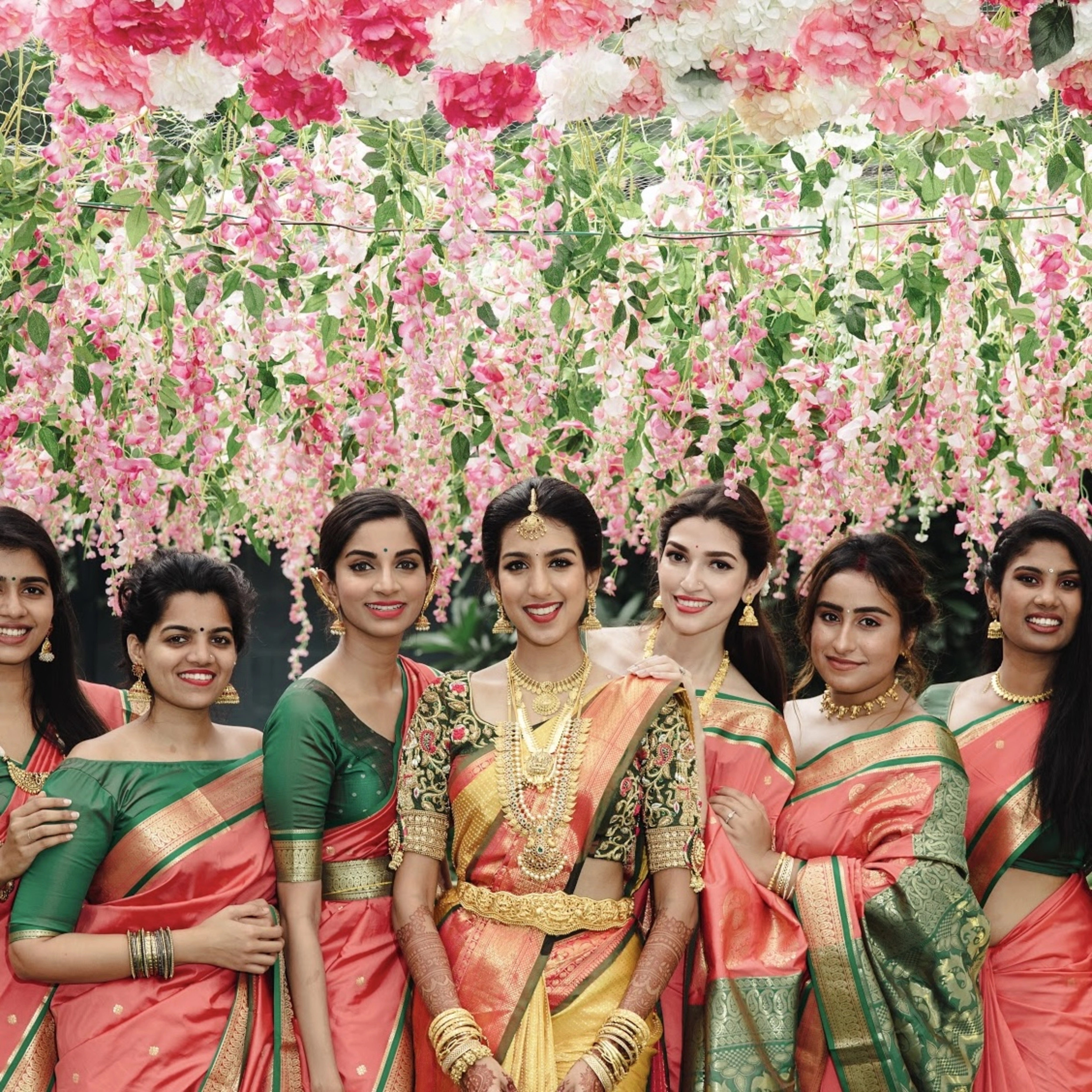 Model Ashwini Kumar with Sahithya Jagannathan and Pallavi Sadanand in a green silk blouse for her wedding with Kavin Venkatesh of Maybell, handcrafted intricately with stones, pearls, zardozi, beads, zari and knot work by team Archana Karthick.