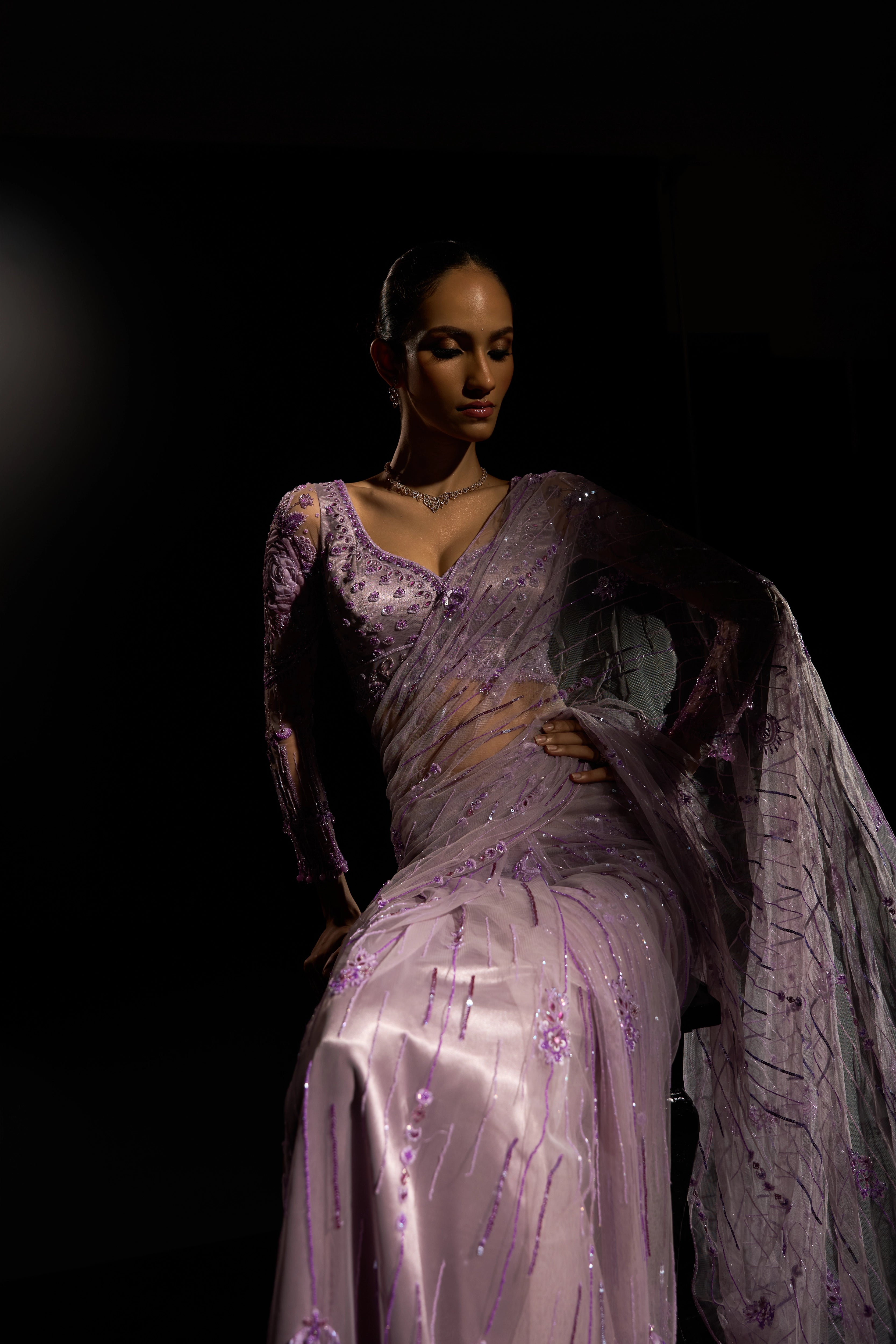 Model Esha Gohil showcasing the shine in a lavender saree set intricately adorned with sequins, rhinestones, crystals and cutdana for "STARDUST" - A/W'25 saree collection by team Archana Karthick.