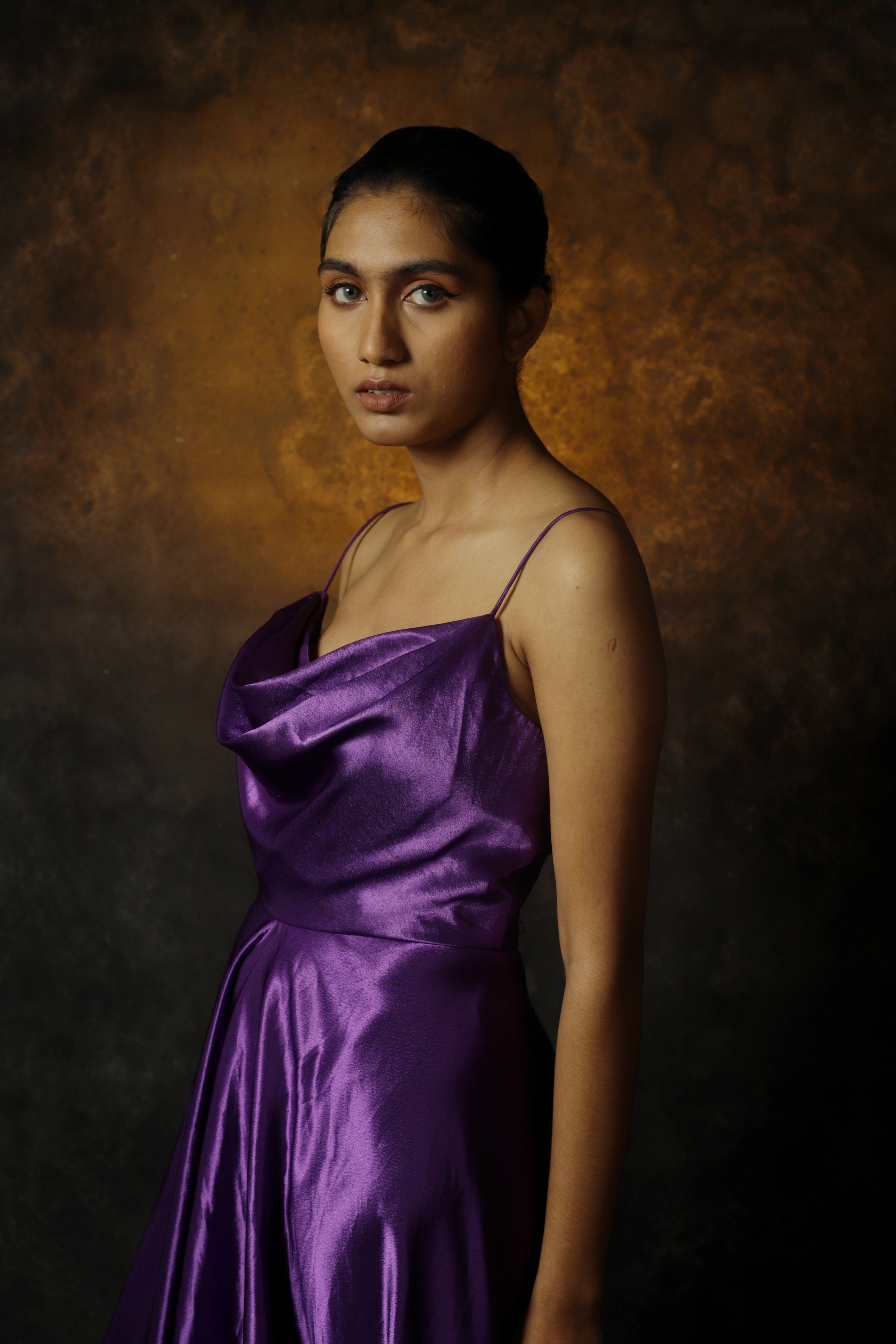 Model Rali Alph in a sleeveless violet satin slip dress by team Archana Karthick.