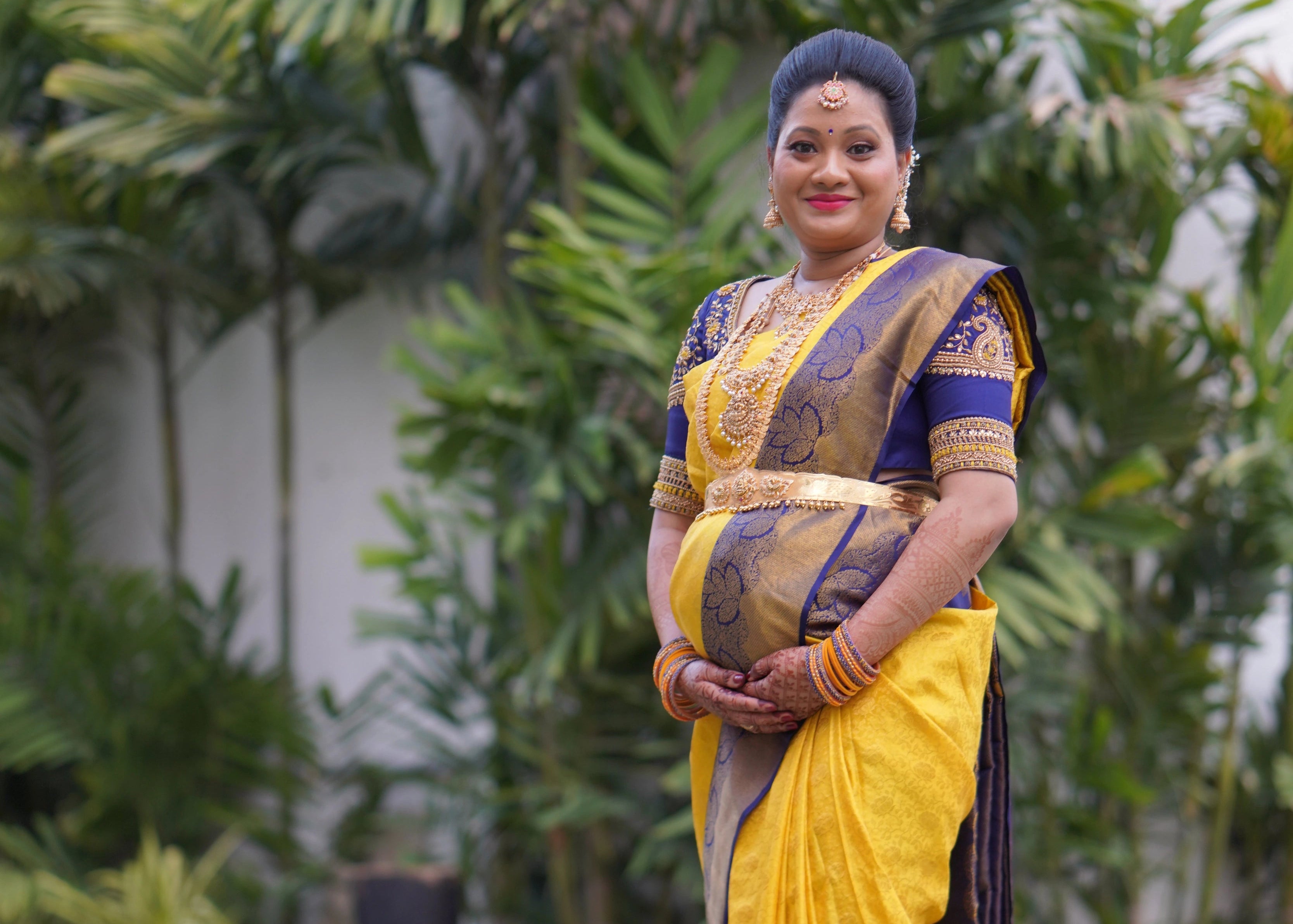 Mom to be from Seattle, USA, in a blue rawsilk blouse designed by Archana Karthick for her baby shower.