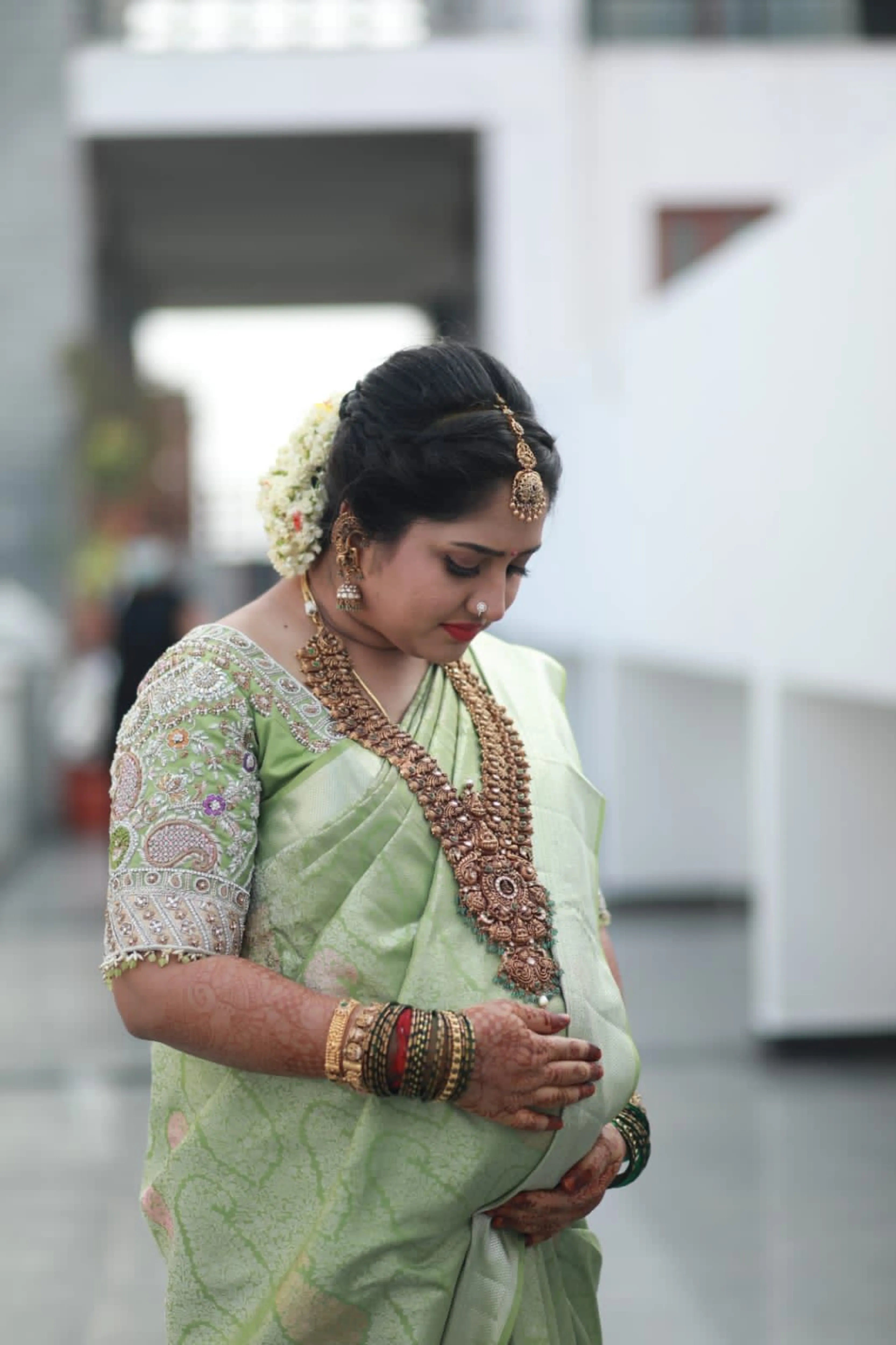 Mother to be, Dr Nivetha from Bangalore in a mint green silk blouse handcrafted by team Archana Karthick.