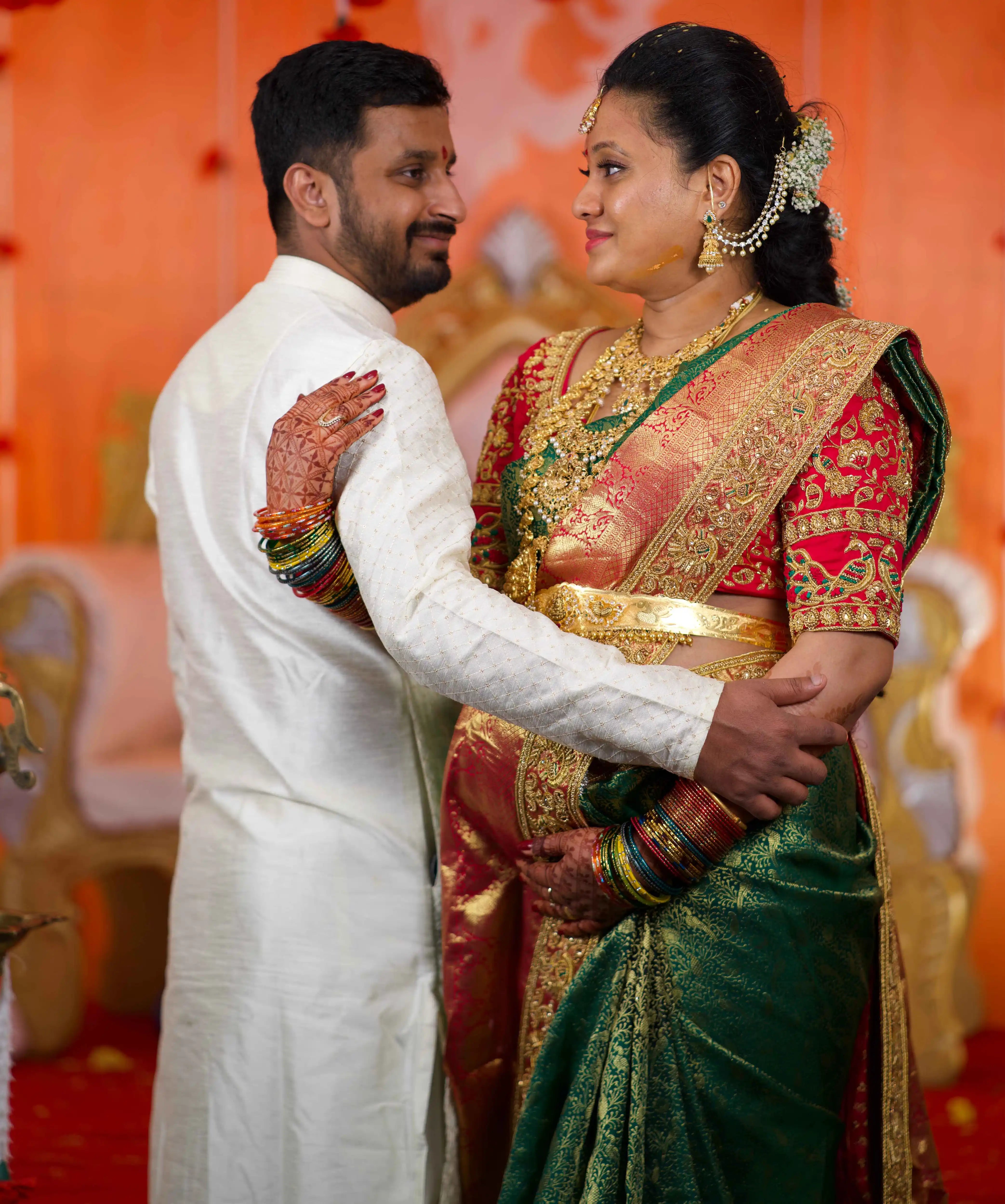 Mother to be, Swathi Pillai from Seattle, USA posing in a pink raw silk blouse and saree border handcrafted by team Archana Karthick.
