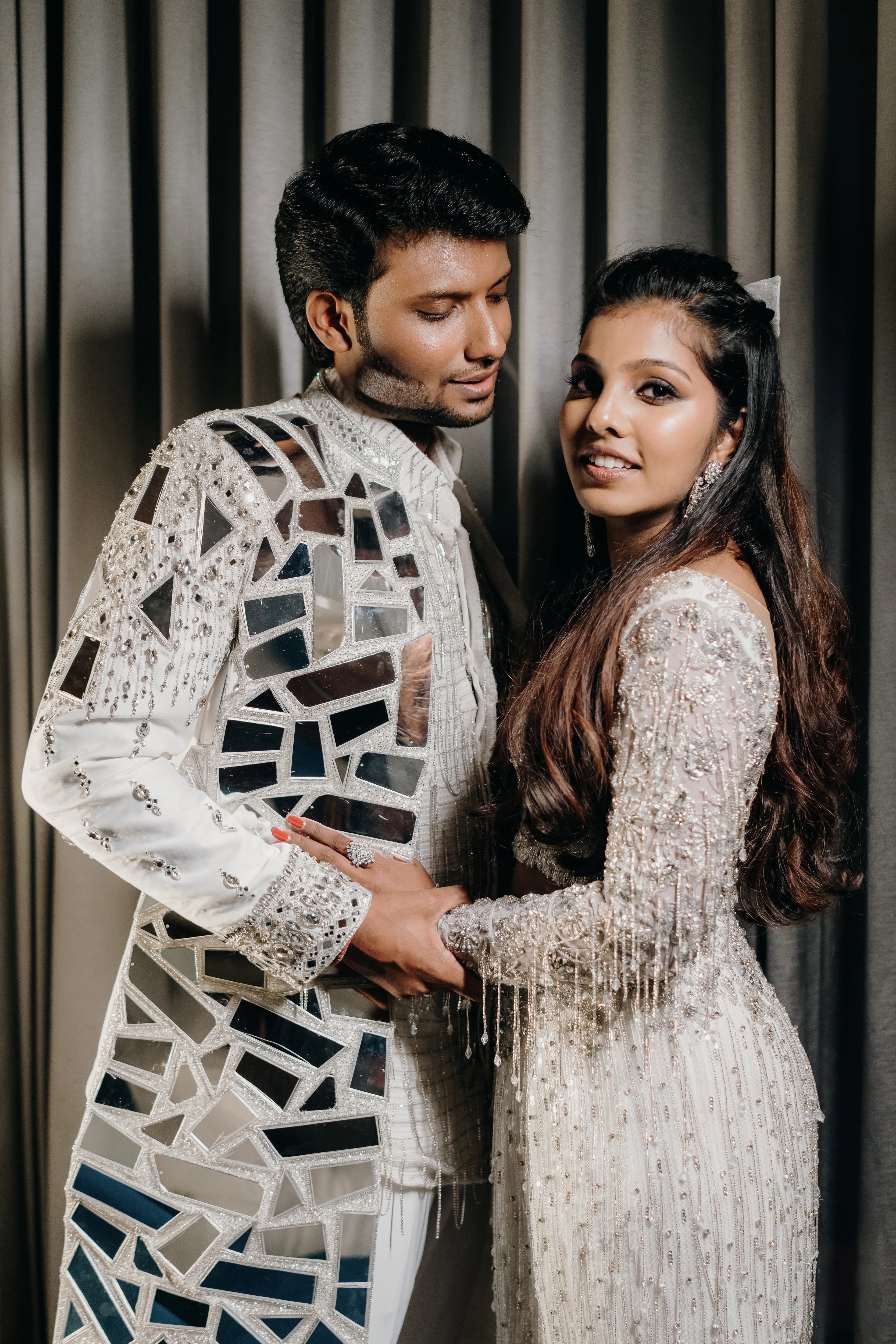 Pooja & Rhevanth in a fusion lehenga and sherwani for their sangeet intricately handcrafted by team Archana Karthick.