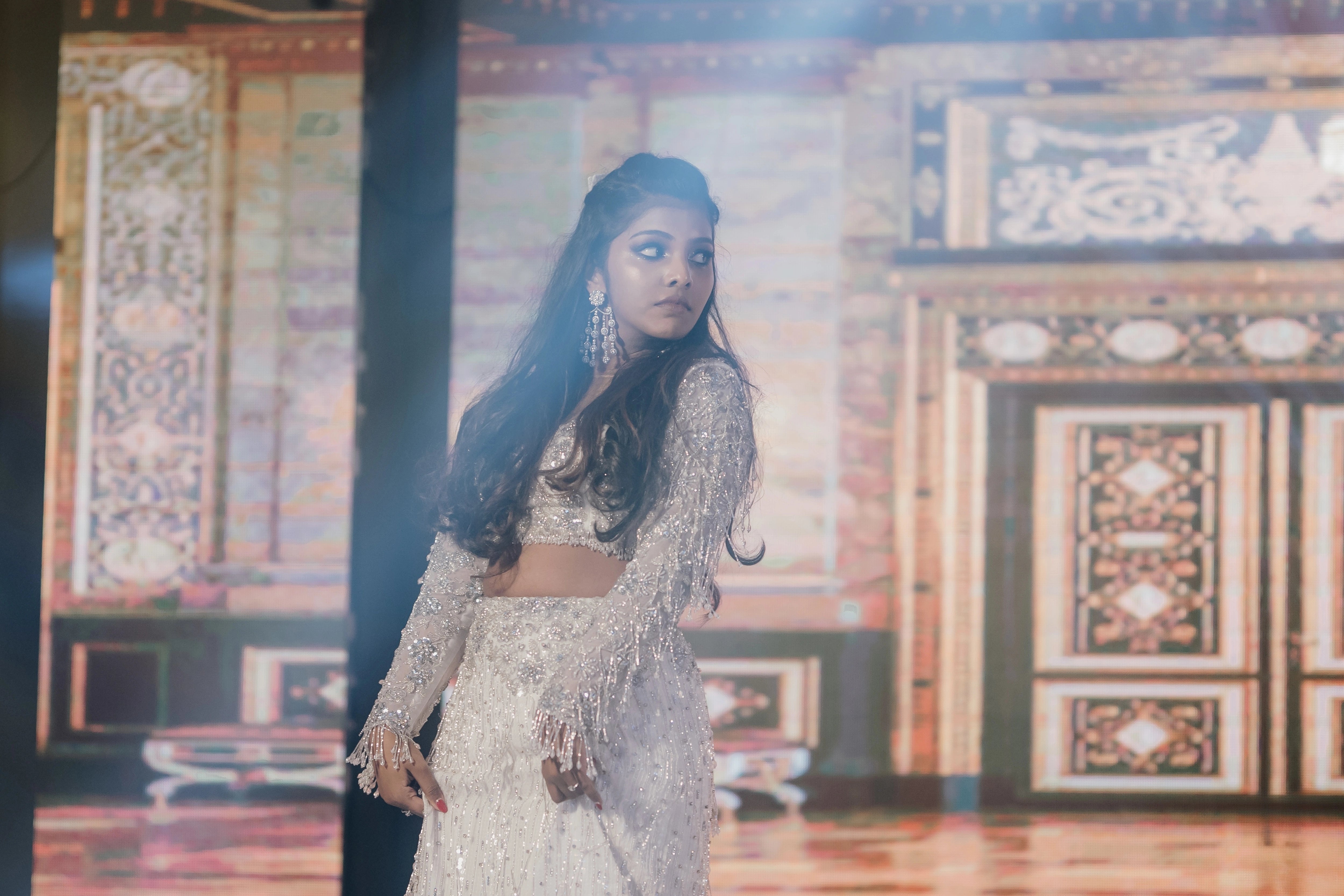 Pooja dancing in a fusion lehenga for her sangeet intricately handcrafted by team Archana Karthick.