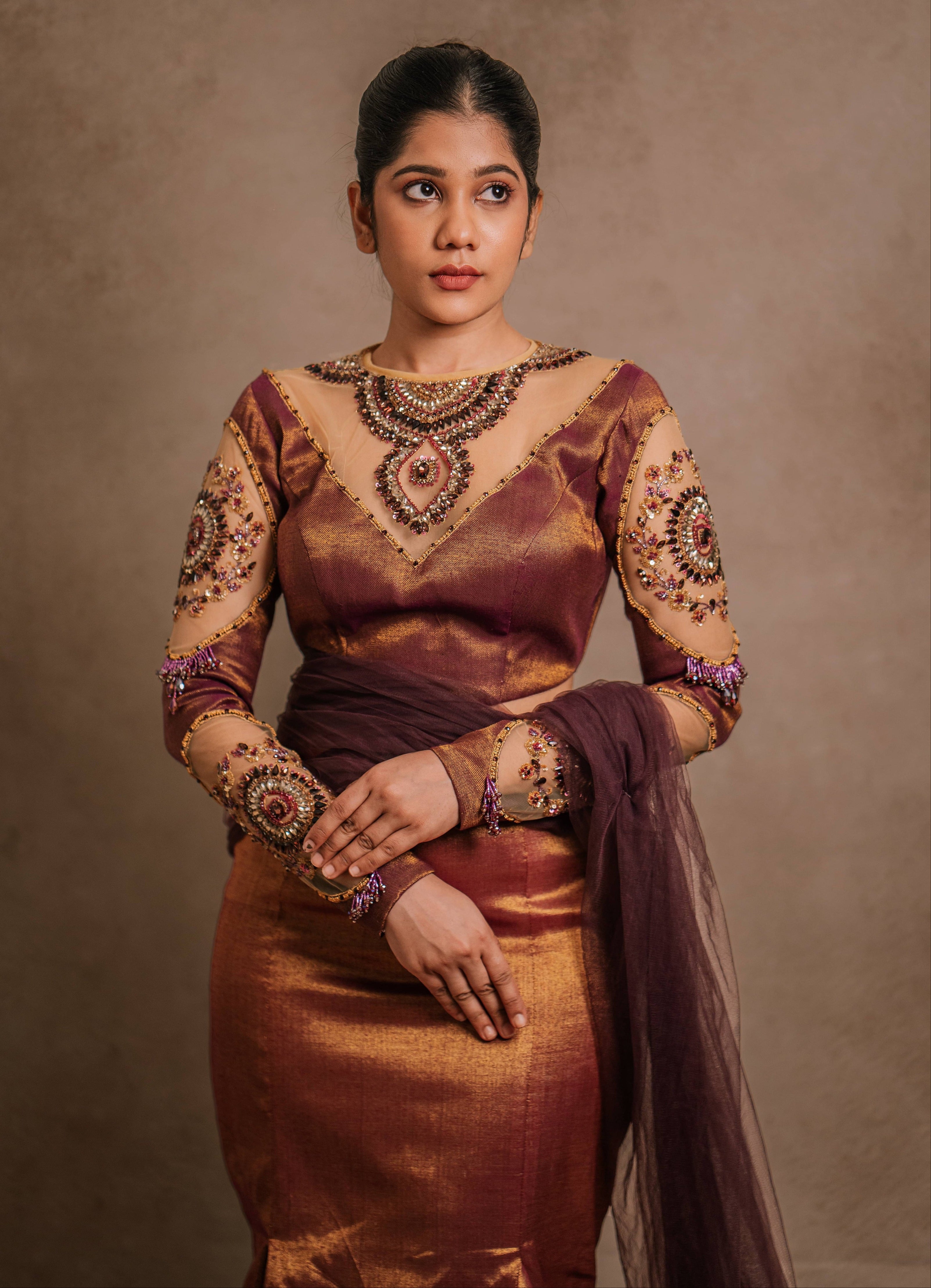 Showcasing yoke in a tissue lehenga with a mermaid skirt & a tulle dupatta intricately handcrafted with stones, crystals, and sequins by team Archana Karthick.