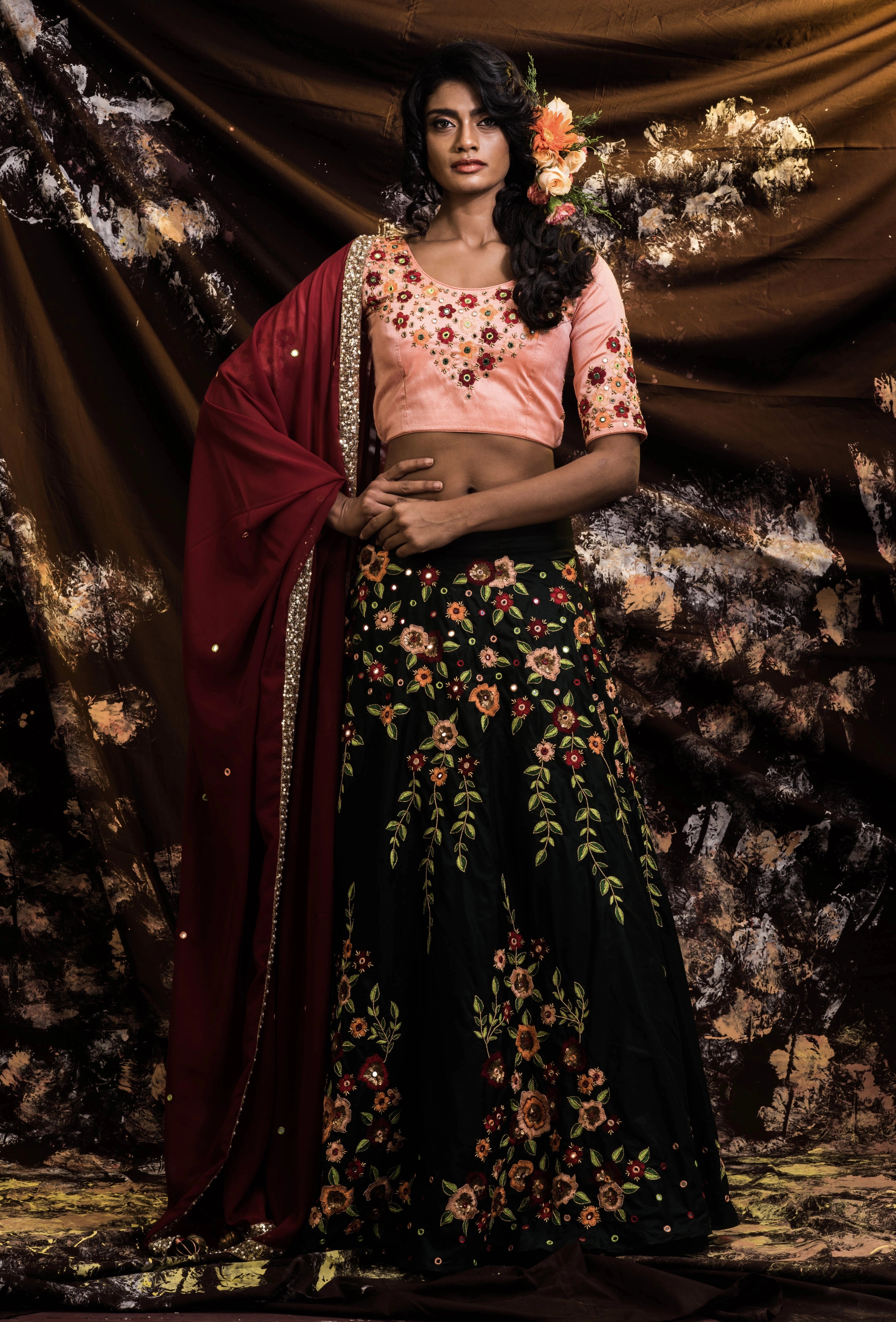 Supermodel Archana Akil Kumar in a rawsilk peach and bottle green lehenga with a maroon georgette dupatta intricately handcrafted by team Archana Karthick.