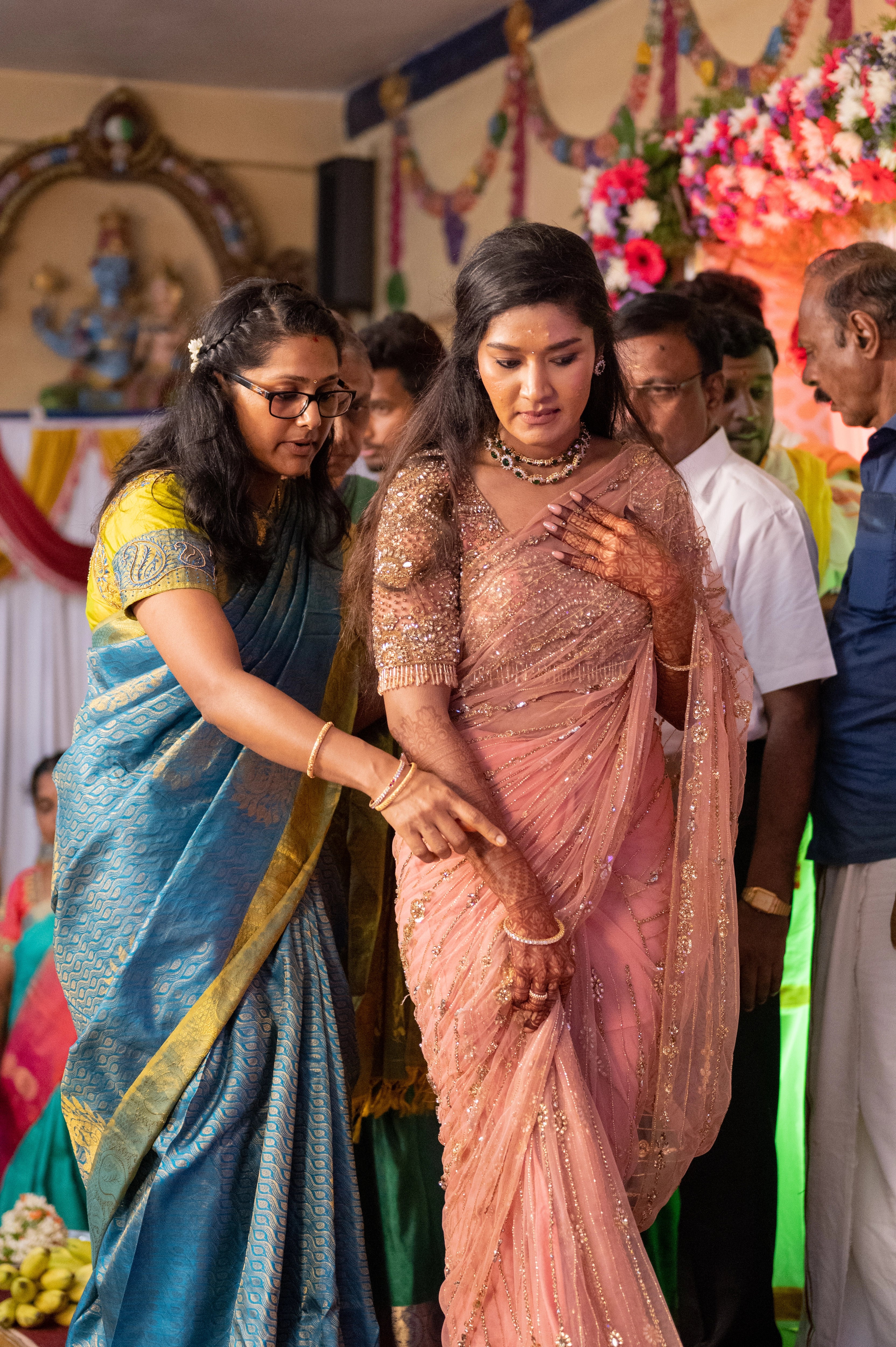 Vaishali from Dubai during wedding in a peach pink saree handcrafted by team Archana Karthick.