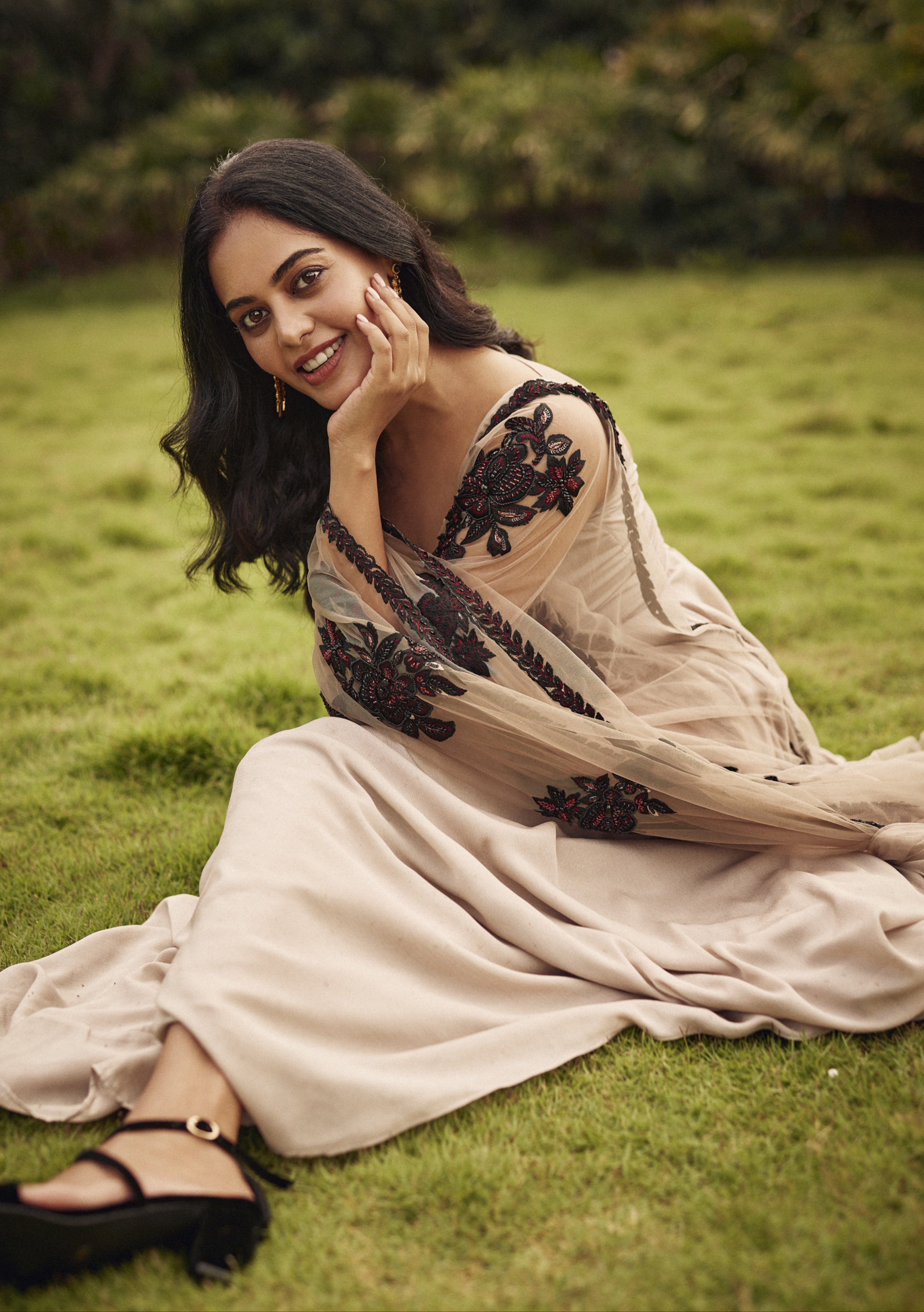 Bindu Madhavi posing in a satin georgette anarkali with a stunning embellished net dupatta, showcasing handcrafted fashion.