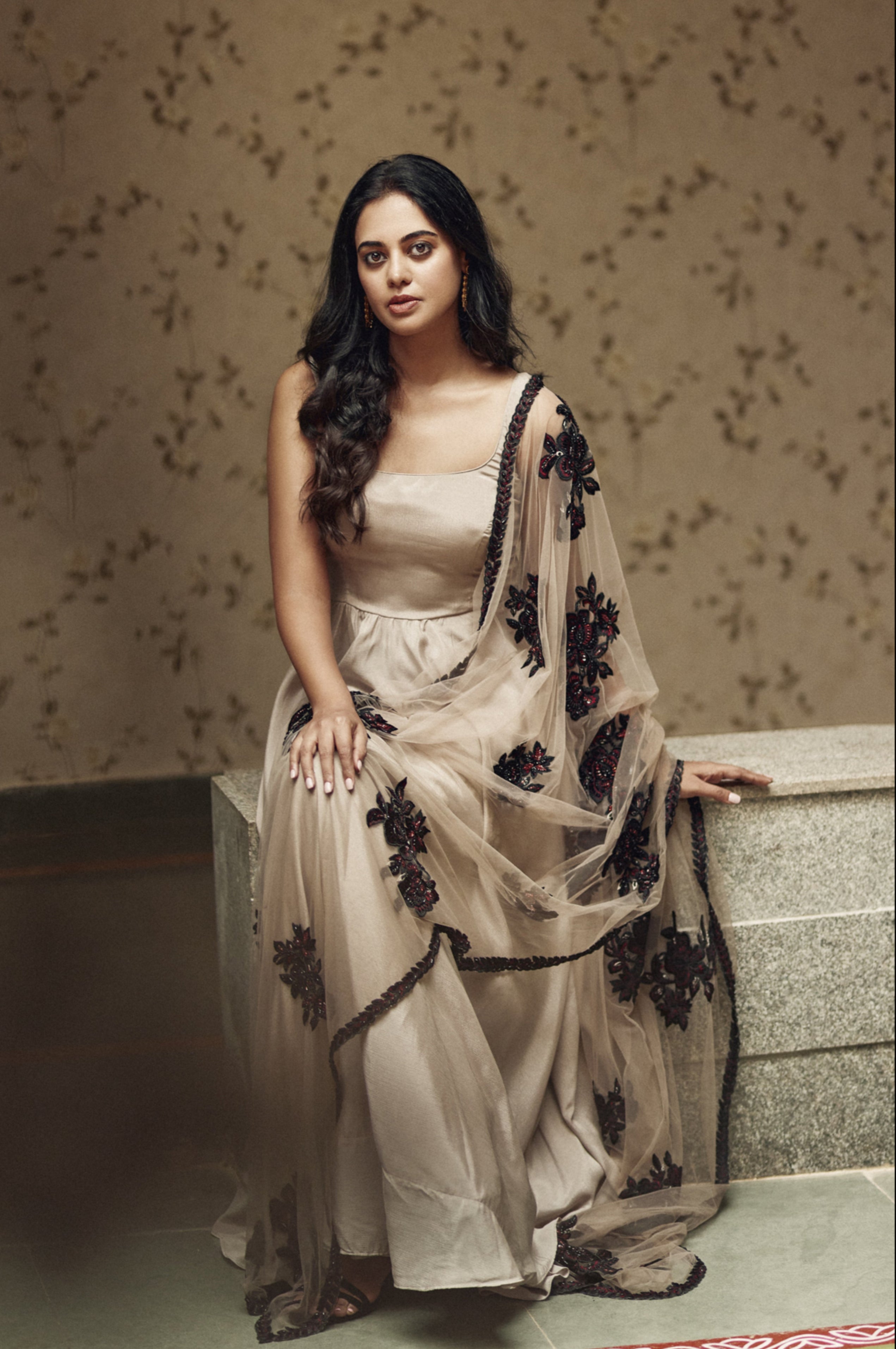 Actress Bindu Madhavi exuding grace in a handcrafted satin georgette anarkali with an embellished net dupatta, perfect for handcrafted fashion.