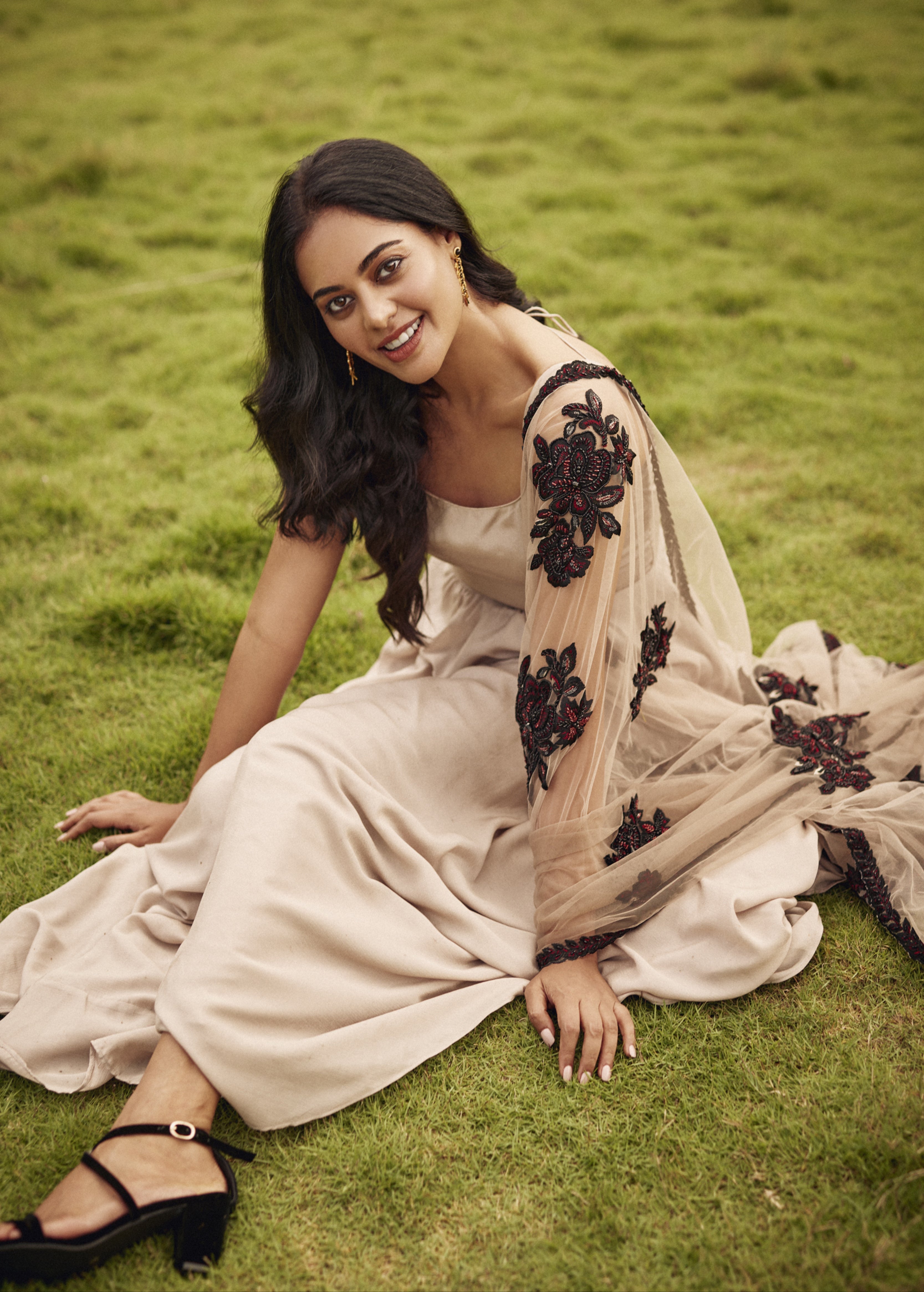 Elegant shot of Bindu Madhavi in a satin georgette anarkali with a beautifully embellished net dupatta, ideal for handcrafted fashion.