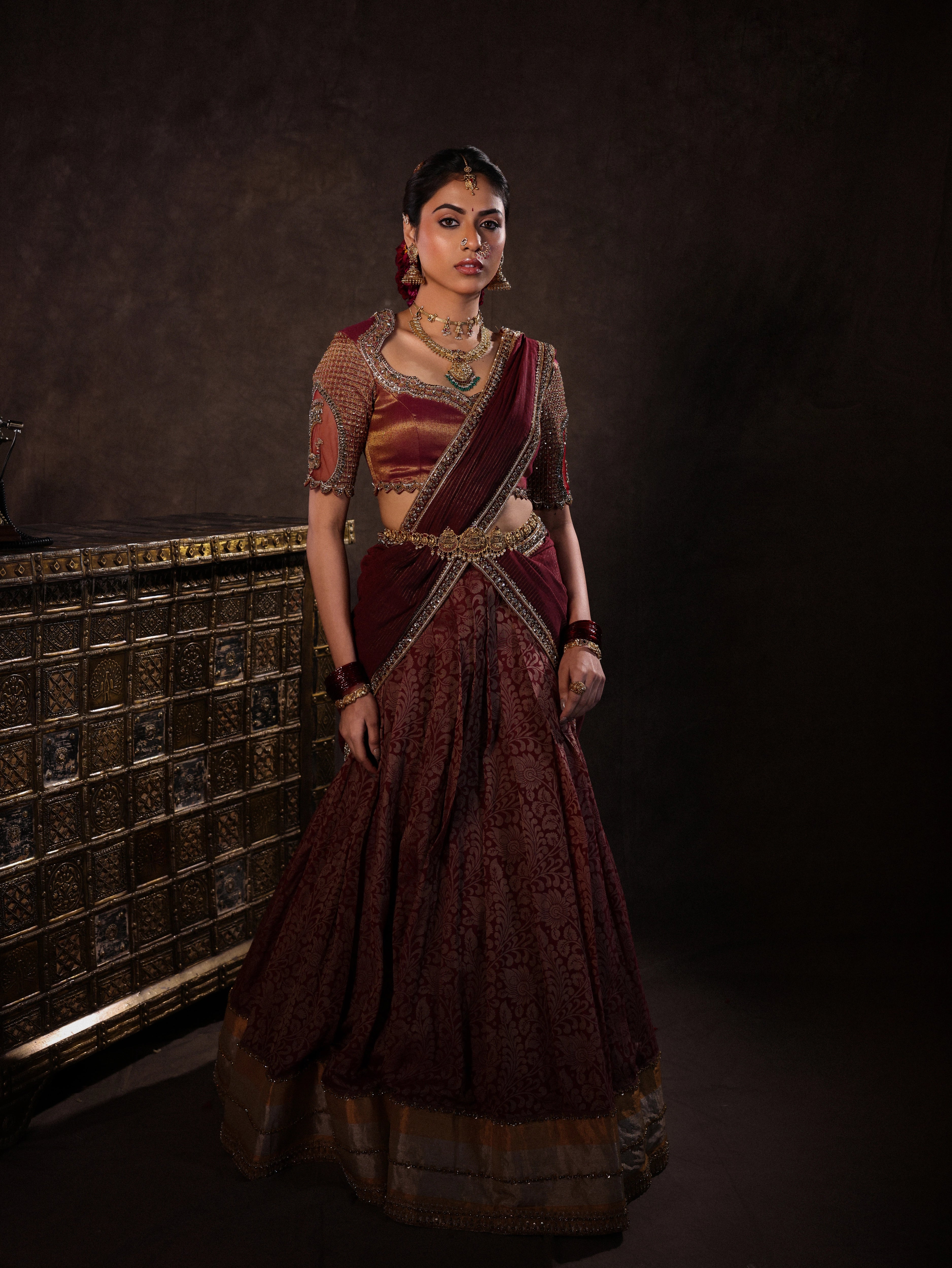 Femina Miss India Unition Territory Dr Sree Advaita in brown maroon kalamkari silk half saree with glass bangles & jewellery