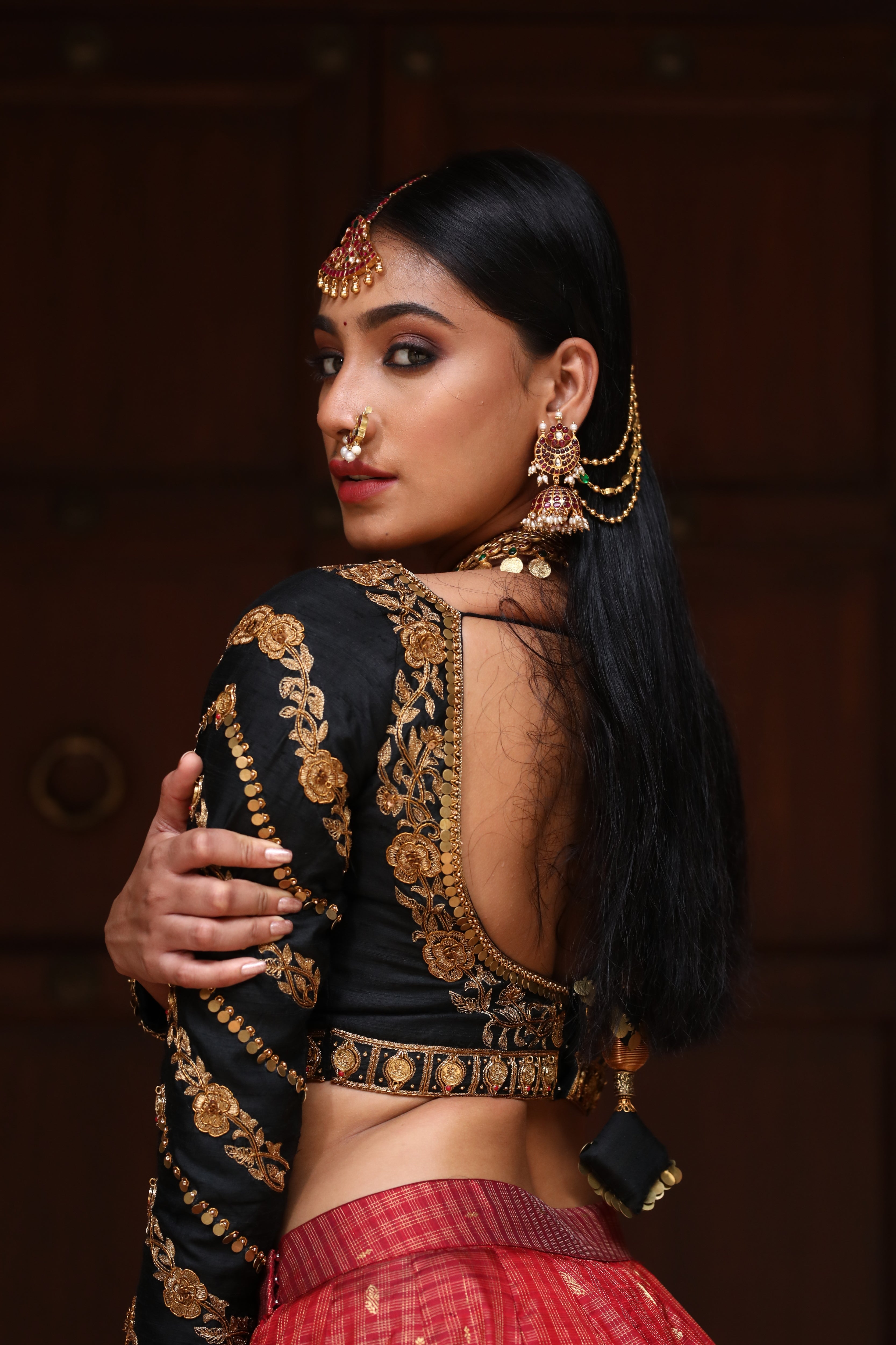 miss india 2018 and actress Anukreethy Vas in lehenga designed by archana karthick posing looking behind hand on elbow back blouse design