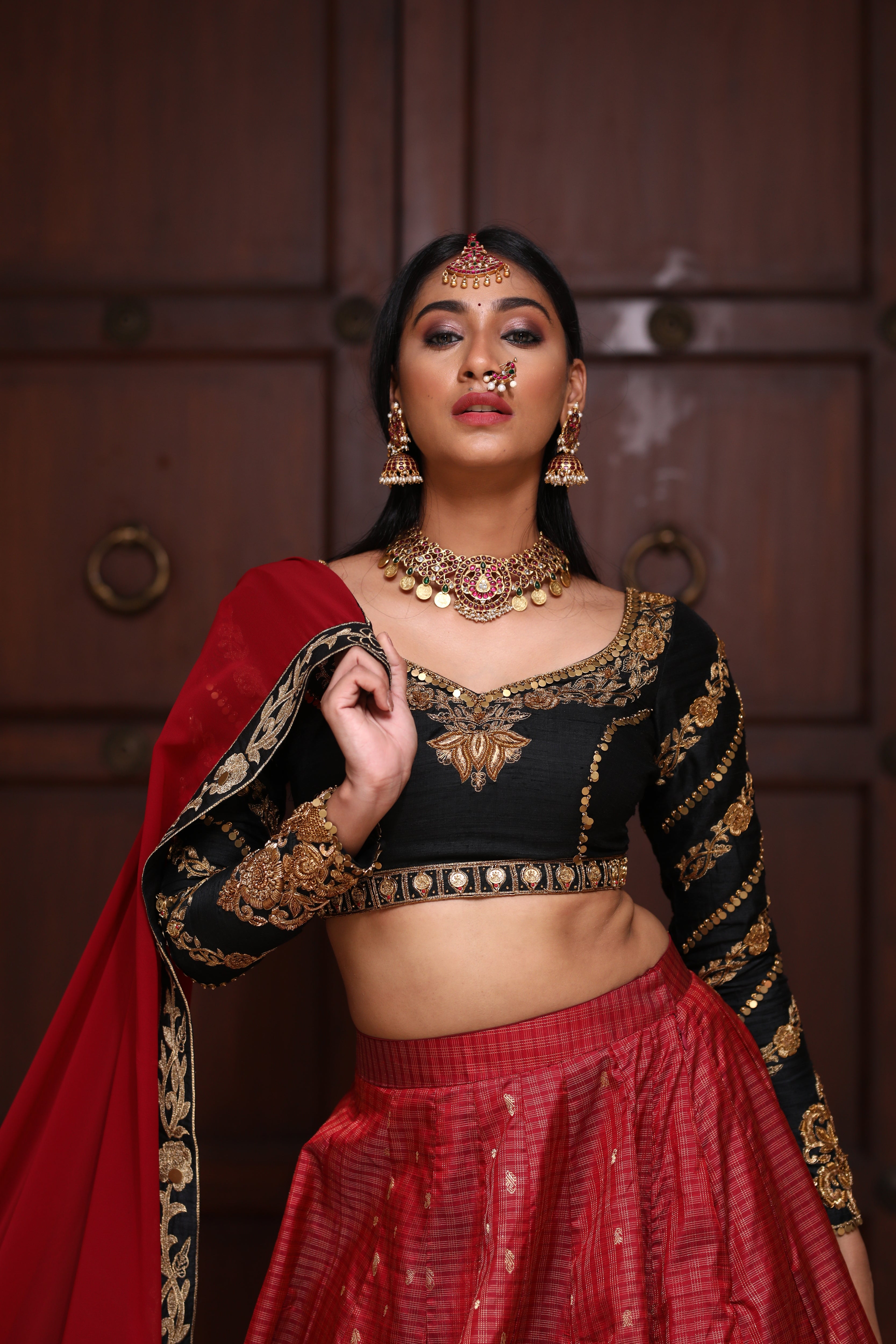 miss india 2018 and actress Anukreethy Vas in lehenga designed by archana karthick posing standing straight with dupatta like jacket over shoulder