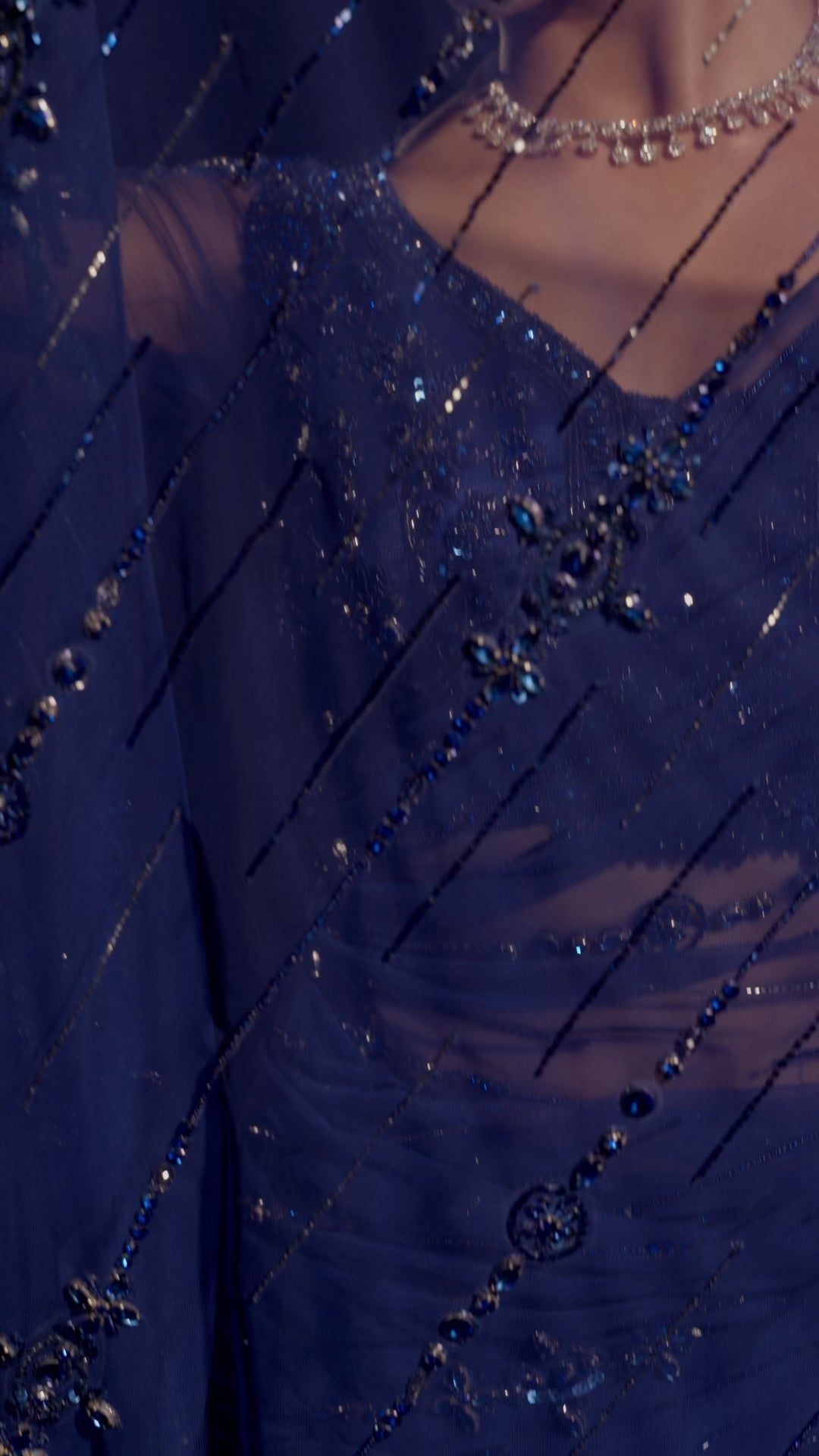 Model Jane C Thompson in a video during photoshoot in a sapphire blue saree set intricately adorned with sequins, rhinestones, crystals and cutdana for "STARDUST" - A/W'25 saree collection by team Archana Karthick.