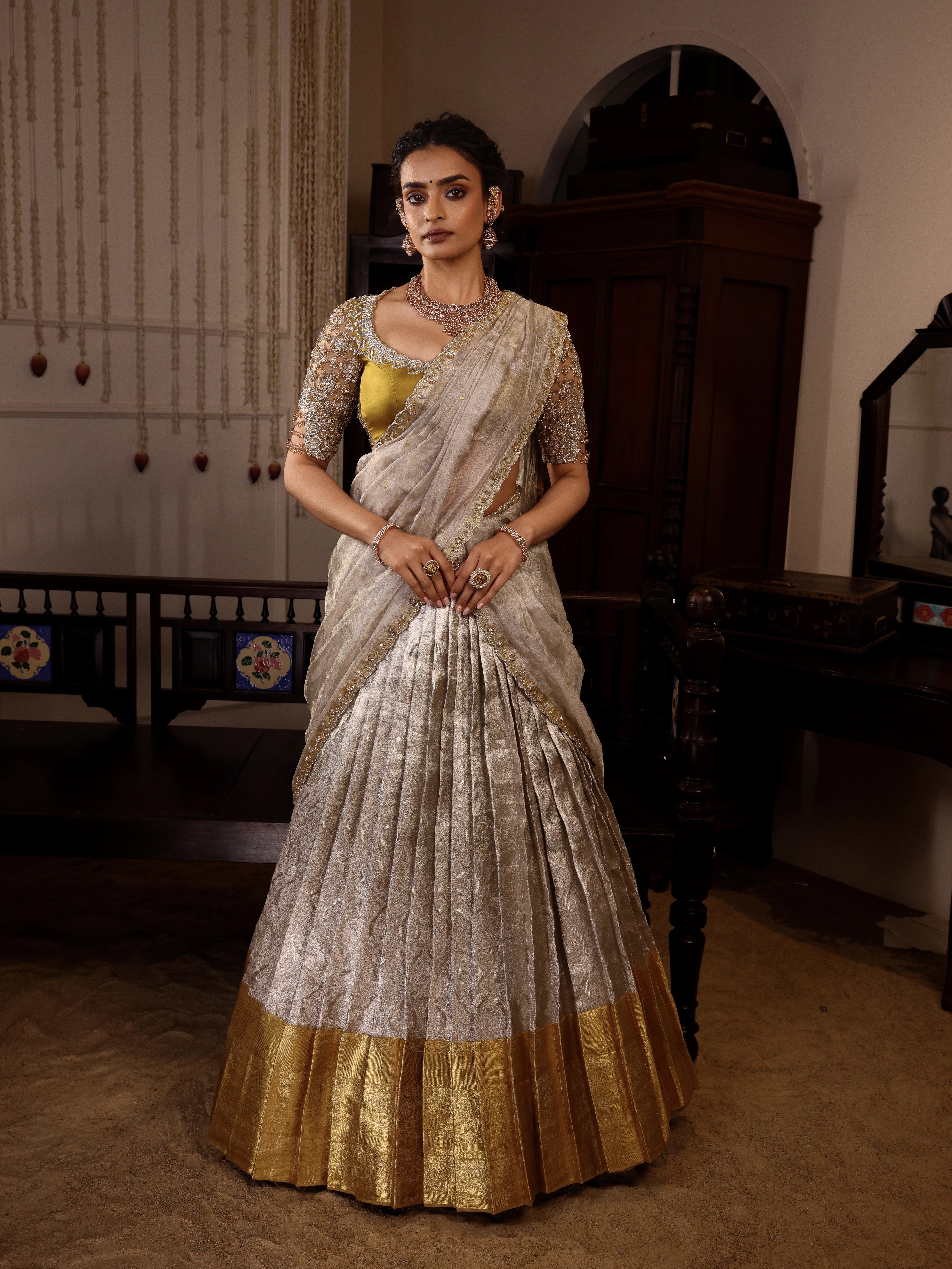 Model Sanskriti Mishra poses in gold and silver kanjeevaram tissue silk half saree with vummidi bangaru jewllery