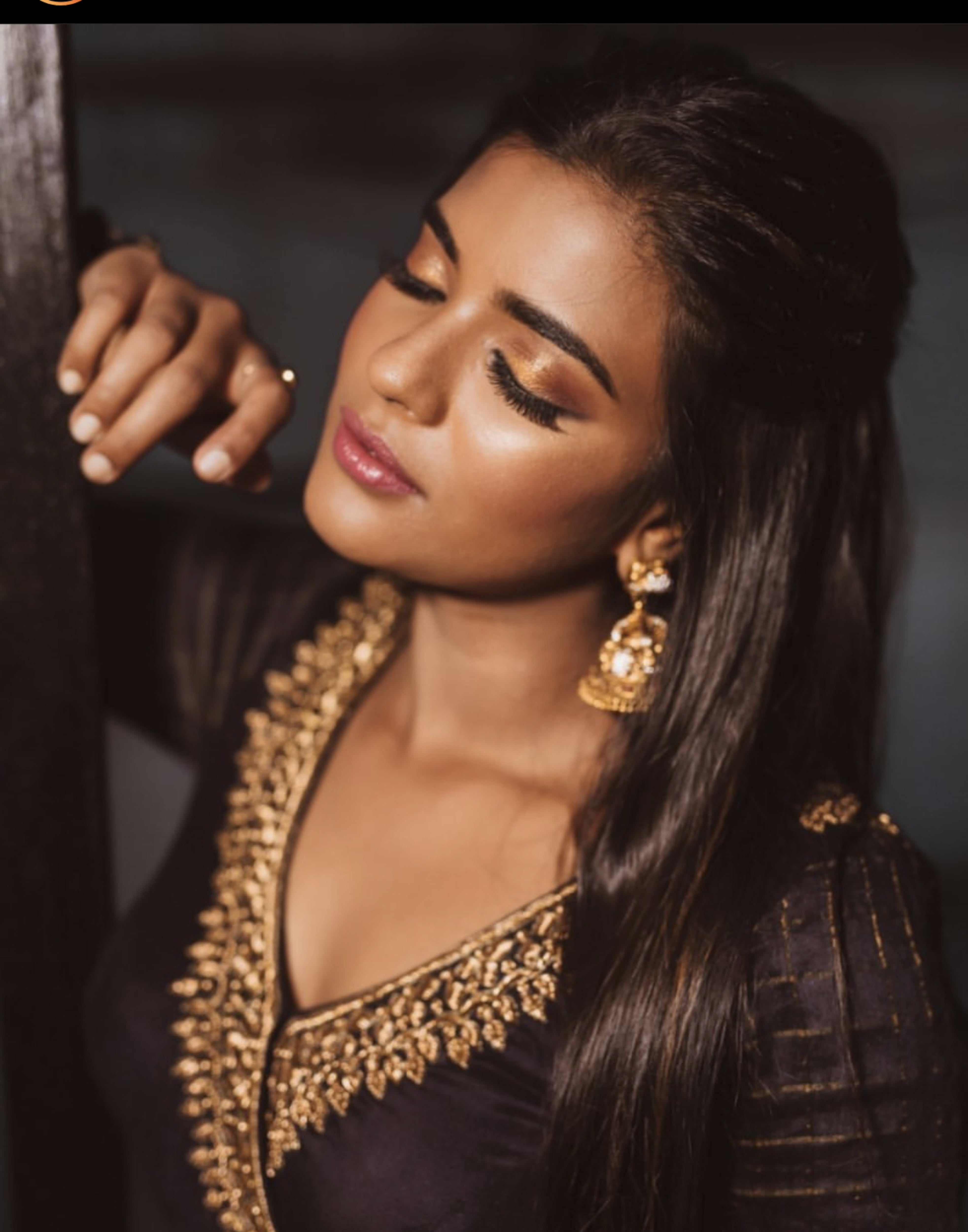 Actress Aishwarya Rajesh posing in a black silk angrakha anarkali