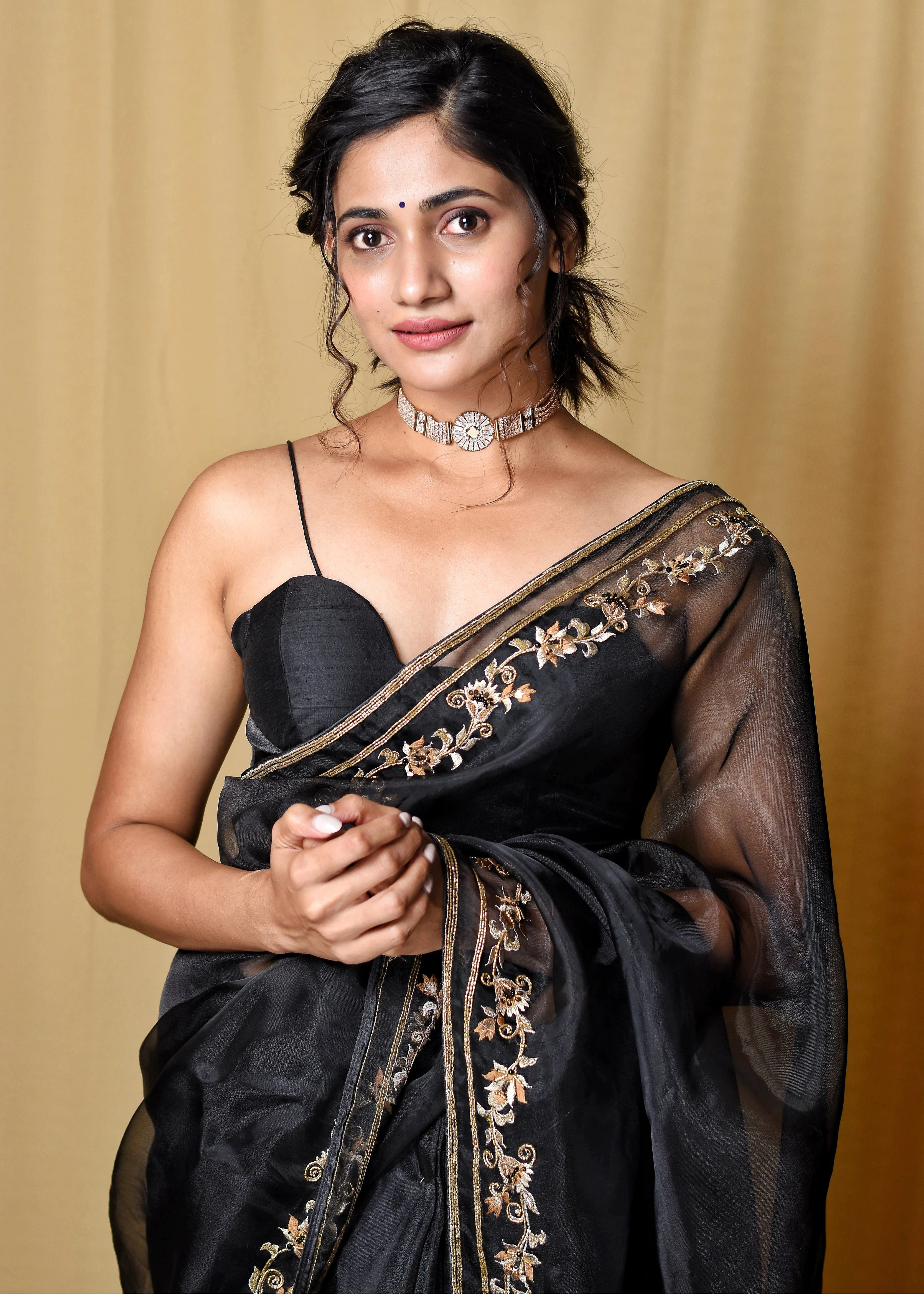 Actress & Bigg Boss fame Losliya in a black organza saree, intricately handcrafted with cutdana, zari, beads, sequins and resham by team Archana Karthick.