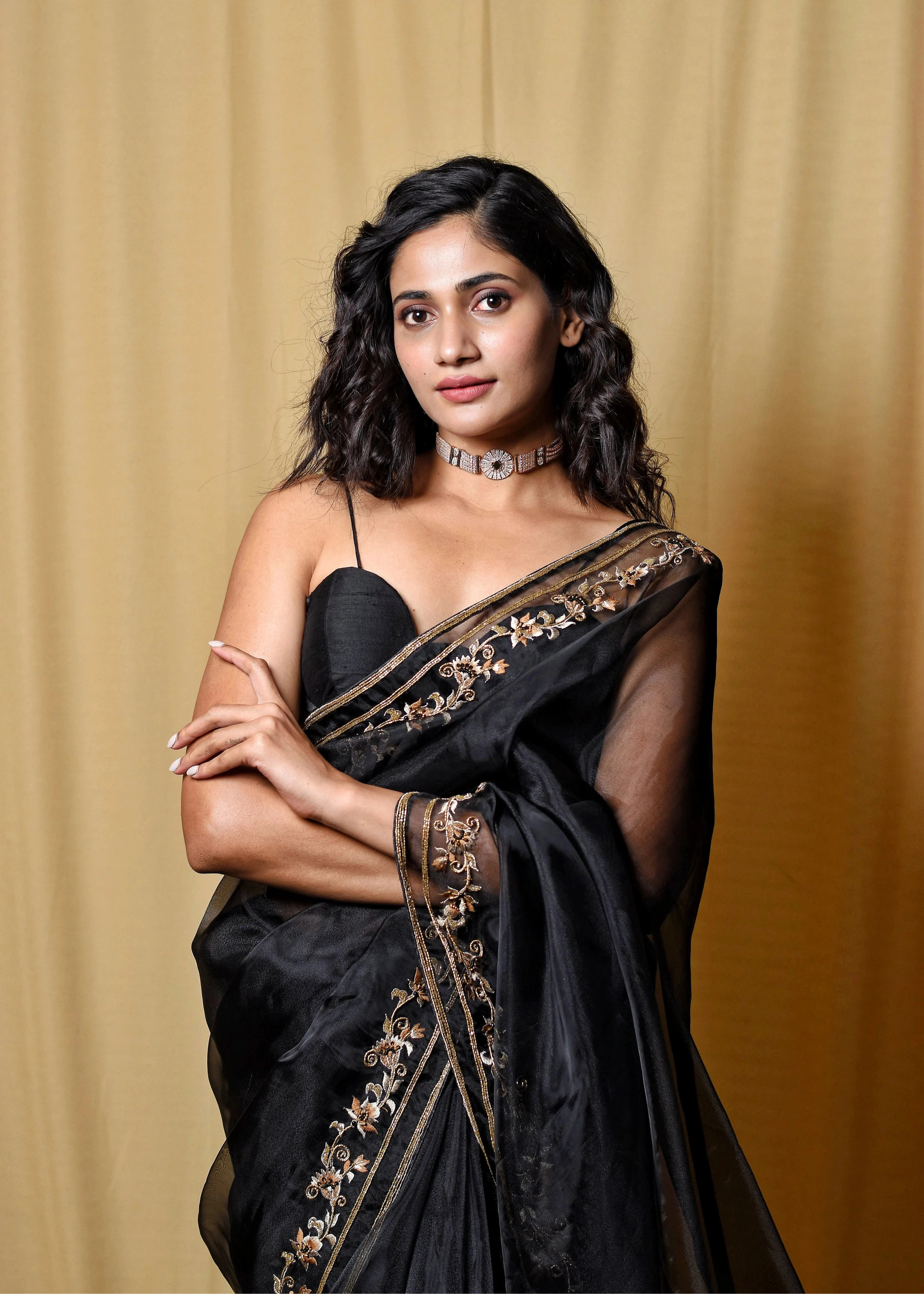 Actress & Bigg Boss fame Losliya posing for photoshoot in a black organza saree, intricately handcrafted with cutdana, zari, beads, sequins and resham by team Archana Karthick.