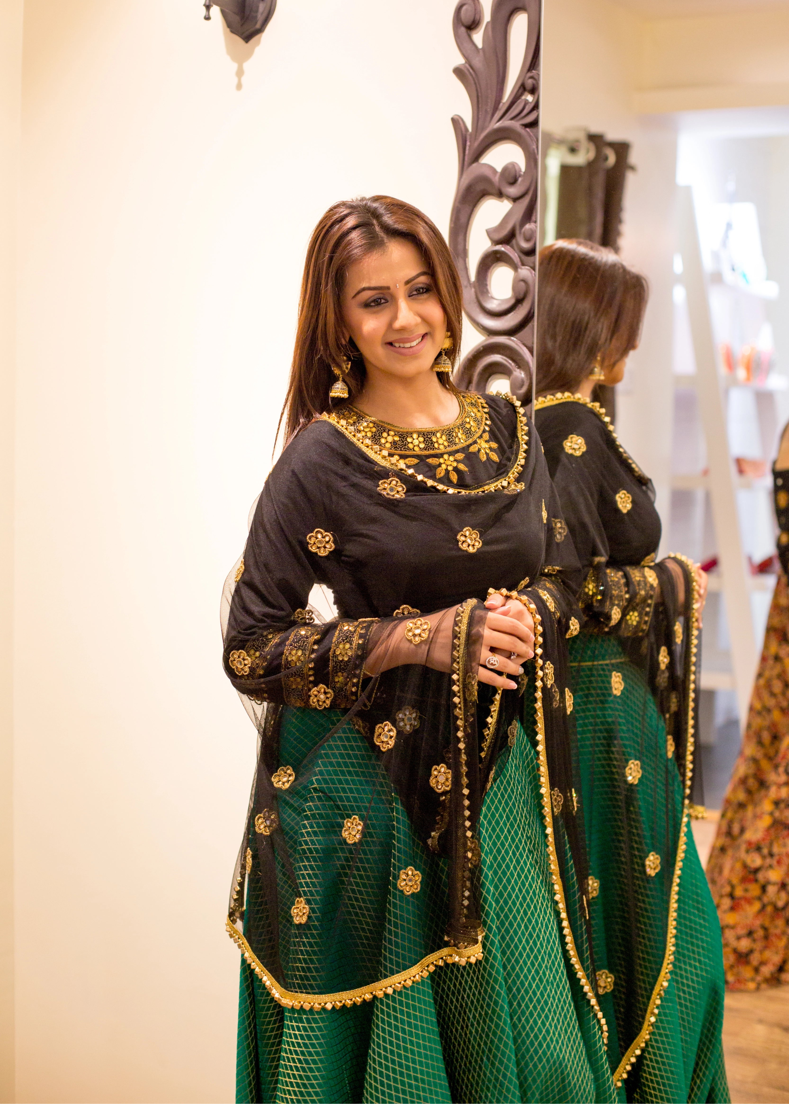 Actress Nikki Galrani in a lehenga designed by Archana Karthick with gota, mirror, cutdana, zardozi and metallic cubes on the border of the tulle dupatta.