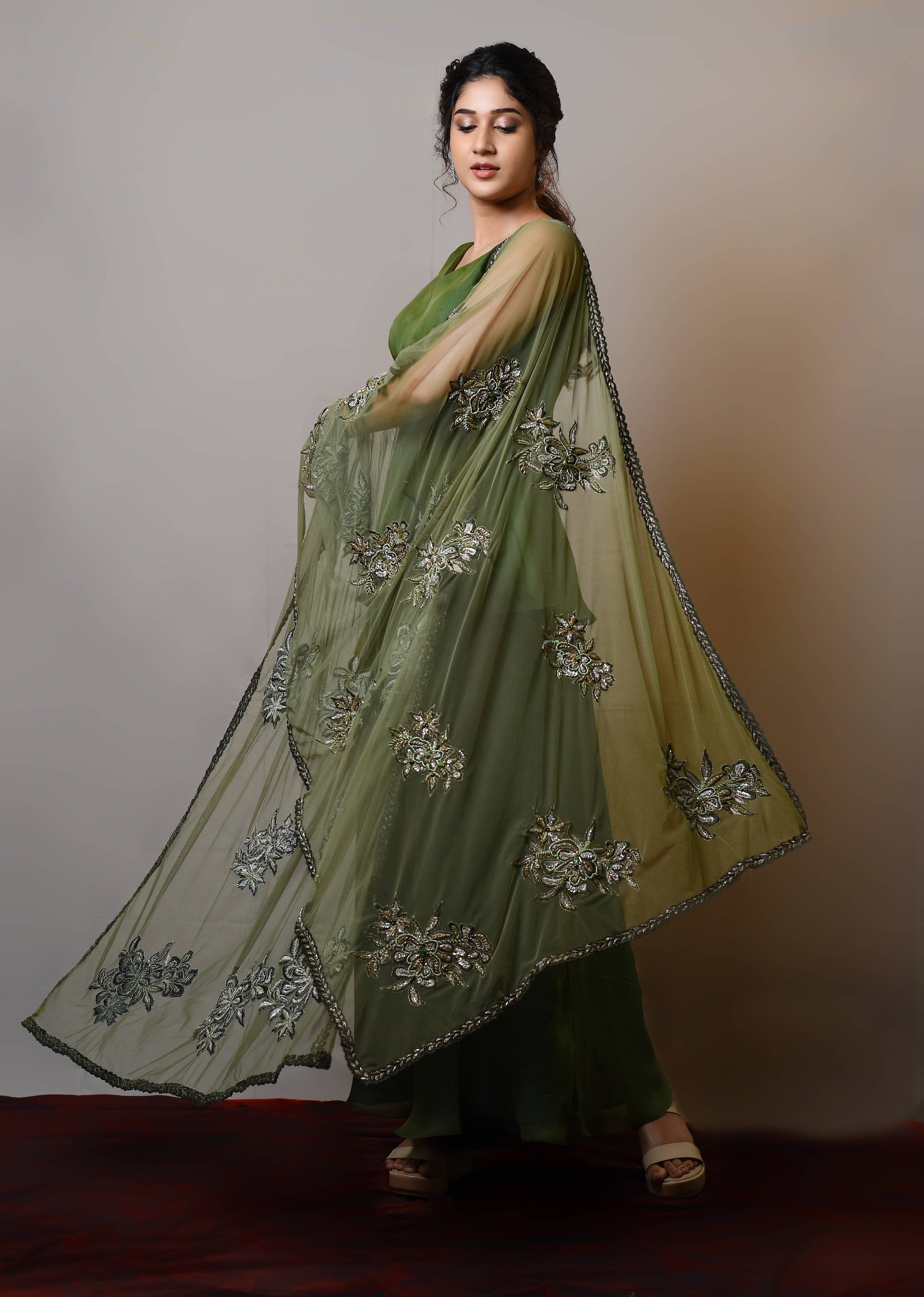 Actress Rabiya Khatoon in a green satin georgette peplum sharara palazzo set with embellished dupatta. Full dupatta detailing.